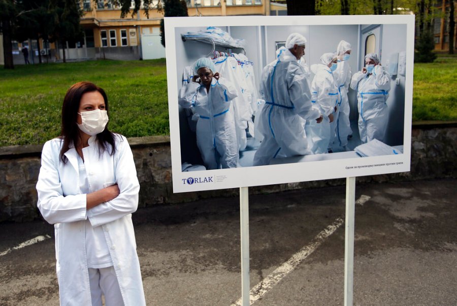 A Torlak Institute's employee waits for the visit of Serbian President Aleksandar Vucic in Belgrade, Serbia, Thursday, April 15, 2021. (AP Photo/Darko Vojinovic)