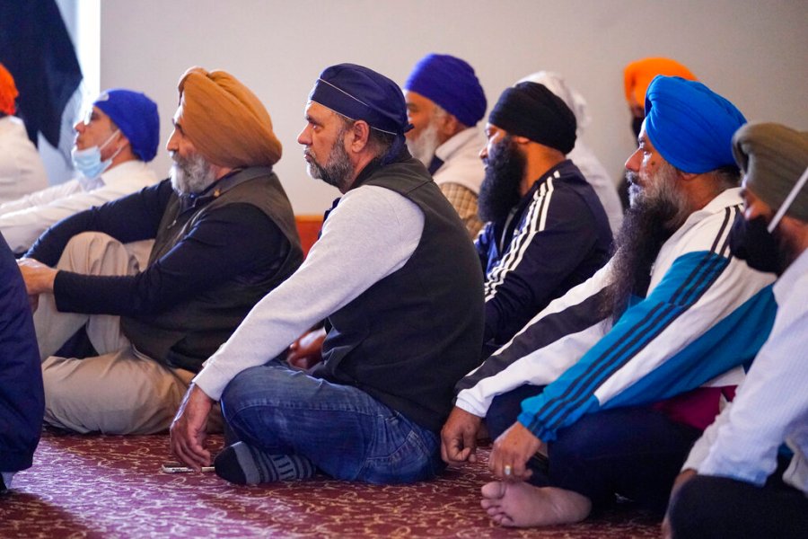 Members of the Sikh Coalition gather at the Sikh Satsang of Indianapolis in Indianapolis, Saturday, April 17, 2021 to formulate the groups response to the shooting at a FedEx facility in Indianapolis that claimed the lives of four members of the Sikh community. (AP Photo/Michael Conroy)