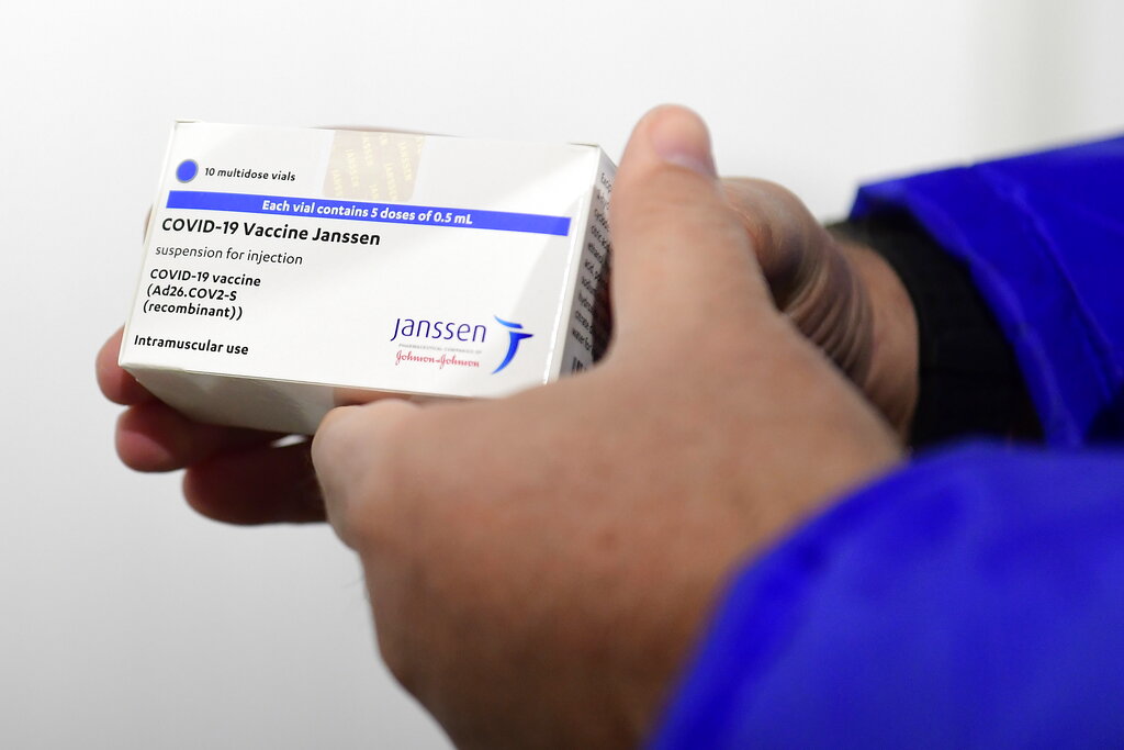 In this April 13, 2021, file photo, a box of Johnson & Johnson vaccines are shown by pharmacist Zsolt Szenasi at a warehouse of Hungaropharma, a Hungarian pharmaceutical wholesale company, in Budapest, Hungary. (Szilard Koszticsak/MTI via AP, File)