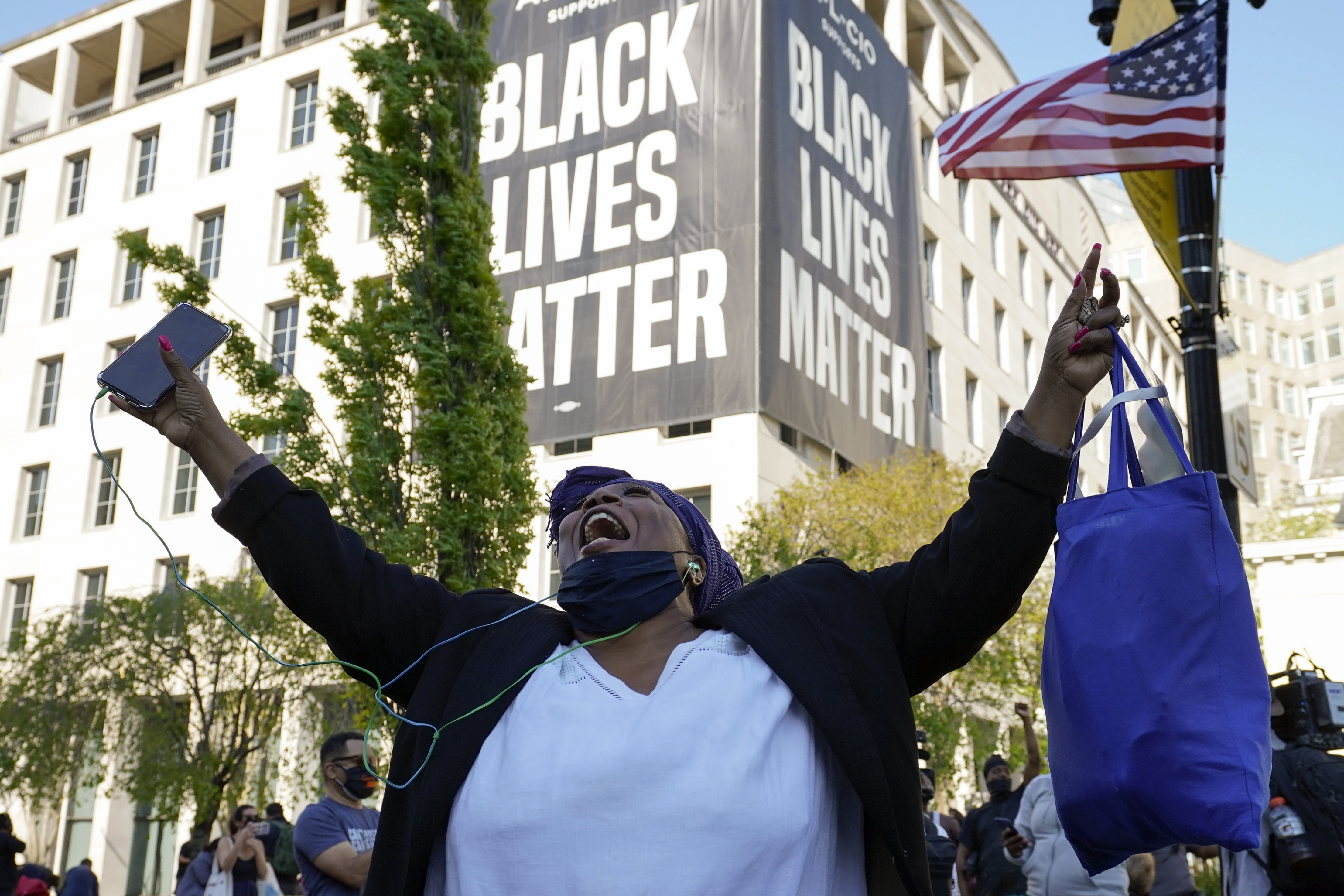 Lisa Robinson of Washington, reacts on April 20, 2021, in D.C., as the guilty verdict is read in Minneapolis in the murder trial against former Minneapolis police officer Derek Chauvin. (Alex Brandon / Associated Press)