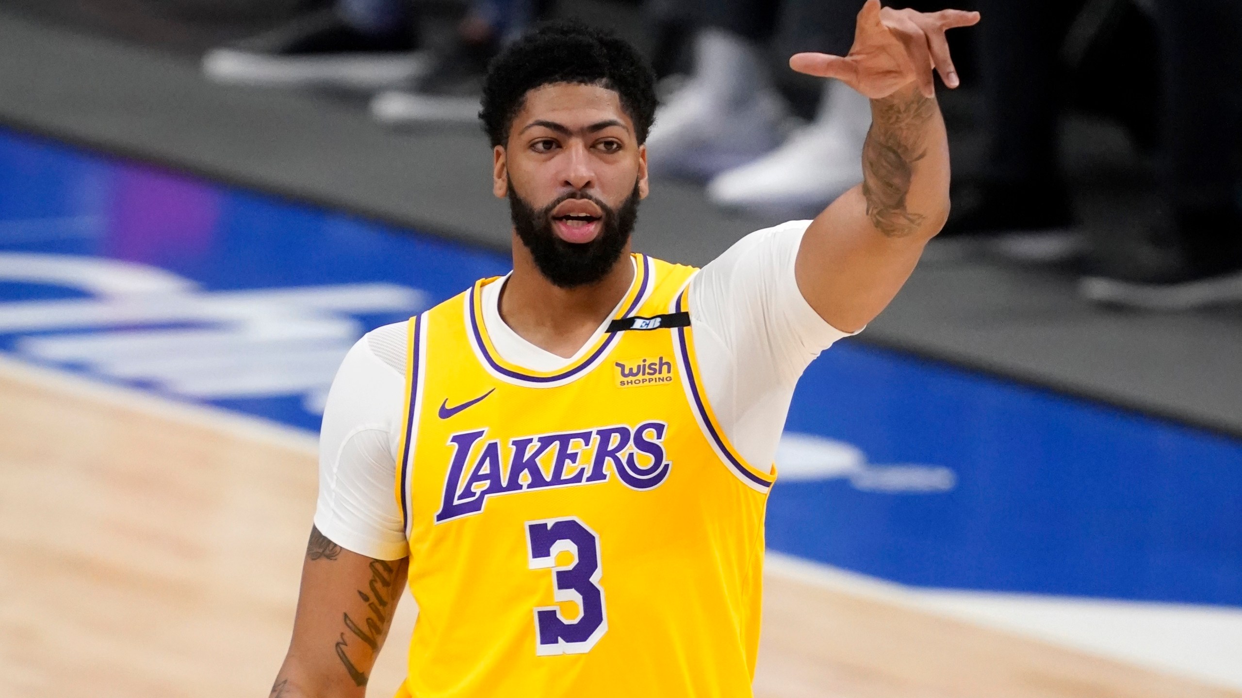 Los Angeles Lakers forward Anthony Davis gestures during the first half of the team's NBA basketball game against the Dallas Mavericks in Dallas, on April 22, 2021. (AP Photo/Tony Gutierrez)