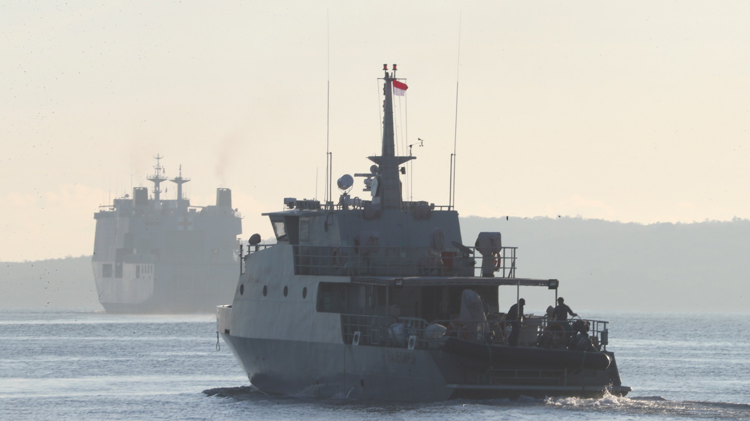 An Indonesian navy patrol ship sails to join the search for submarine KRI Nanggala that went missing while participating in a training exercise on Wednesday, off Banyuwangi, East Java, Indonesia, Saturday, April 24, 2021. (AP Photo/Achmad Ibrahim)