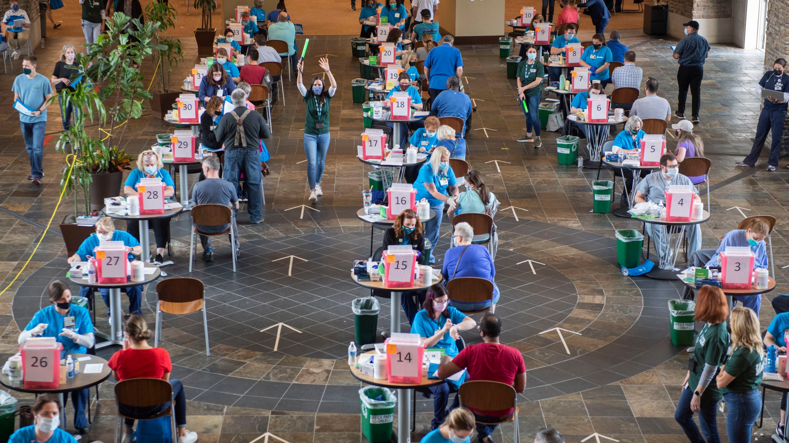 In this April 6, 2021, file photo, Allegheny Health Network hosts a vaccine clinic at DICK'S Sporting Goods' Corporate Office in Coraopolis, a suburb of Pittsburgh. (Emily Matthews/Pittsburgh Post-Gazette via AP, File)