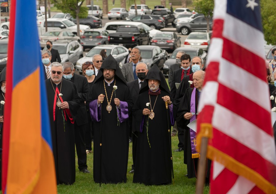 Religious leaders and others attend a ceremony remembering the victims of the Armenian Genocide at the Montebello Armenian Genocide Monument in Montebello, Calif., Saturday, April 24, 2021. The United States is formally recognizing that the systematic killing and deportation of hundreds of thousands of Armenians by Ottoman Empire forces in the early 20th century was "genocide" as President Joe Biden used that precise word that the White House has avoided for decades for fear of alienating ally Turkey. (AP Photo/Damian Dovarganes)