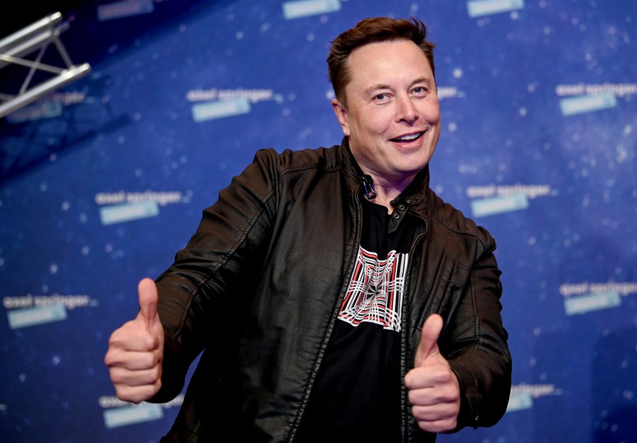 In this Tuesday, Dec. 1, 2020 file photo, SpaceX owner and Tesla CEO Elon Musk arrives on the red carpet for the Axel Springer media award, in Berlin, Germany. Technology mogul Elon Musk has a lined up a new gig in addition to his jobs as CEO of electric car maker Tesla and spaceship maker SpaceX. He is going to host the iconic TV show “Saturday Night Live " on May 8, 2021. (AP Photo/Britta Pedersen, Pool, File)