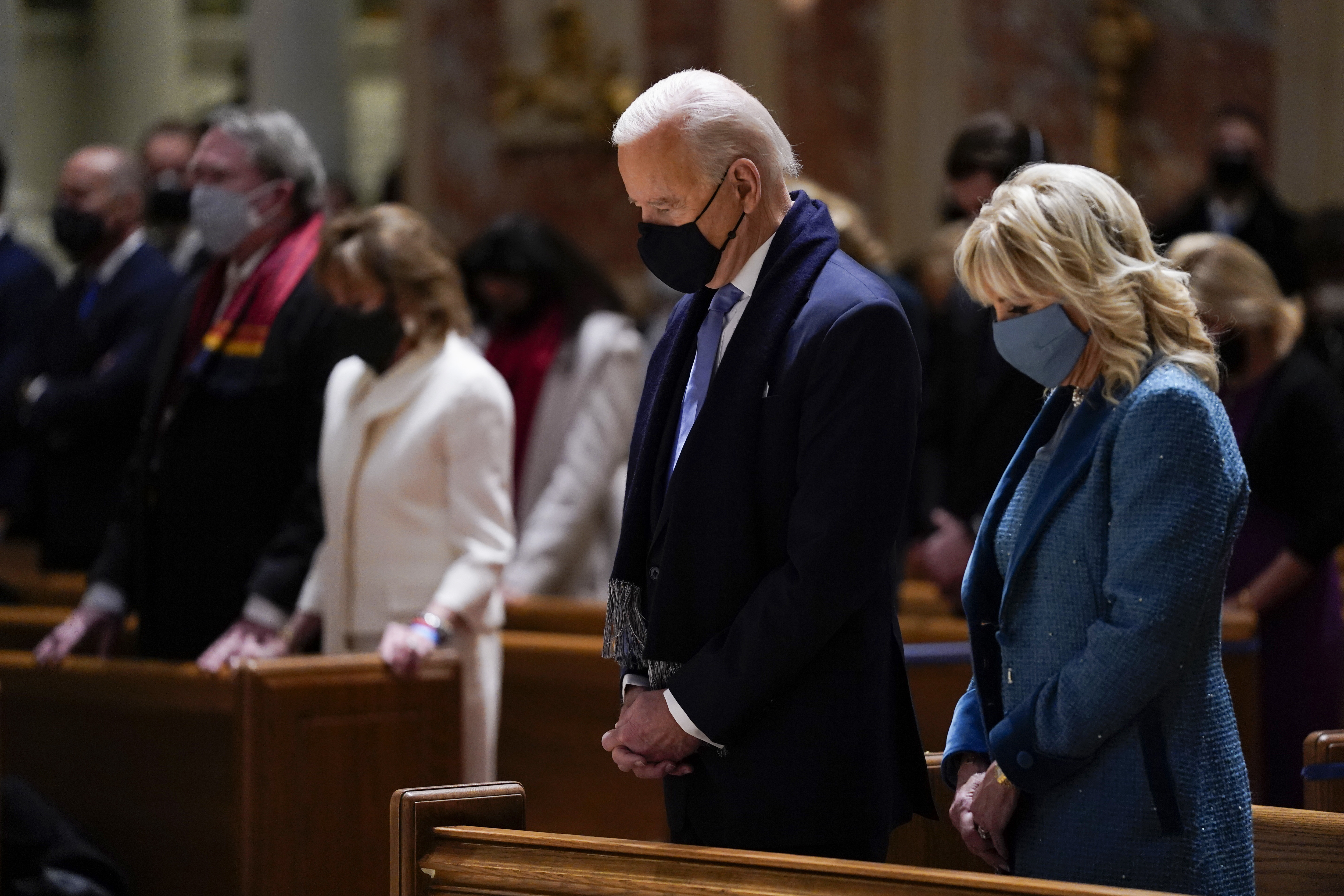 In this Wednesday, Jan. 20, 2021 file photo, President-elect Joe Biden and his wife, Jill Biden, attend Mass at the Cathedral of St. Matthew the Apostle during Inauguration Day ceremonies in Washington. When U.S. Catholic bishops hold their next national meeting in June 2021, they’ll be deciding whether to send a tougher-than-ever message to President Joe Biden and other Catholic politicians: Don’t partake of Communion if you persist in public advocacy of abortion rights. (AP Photo/Evan Vucci)