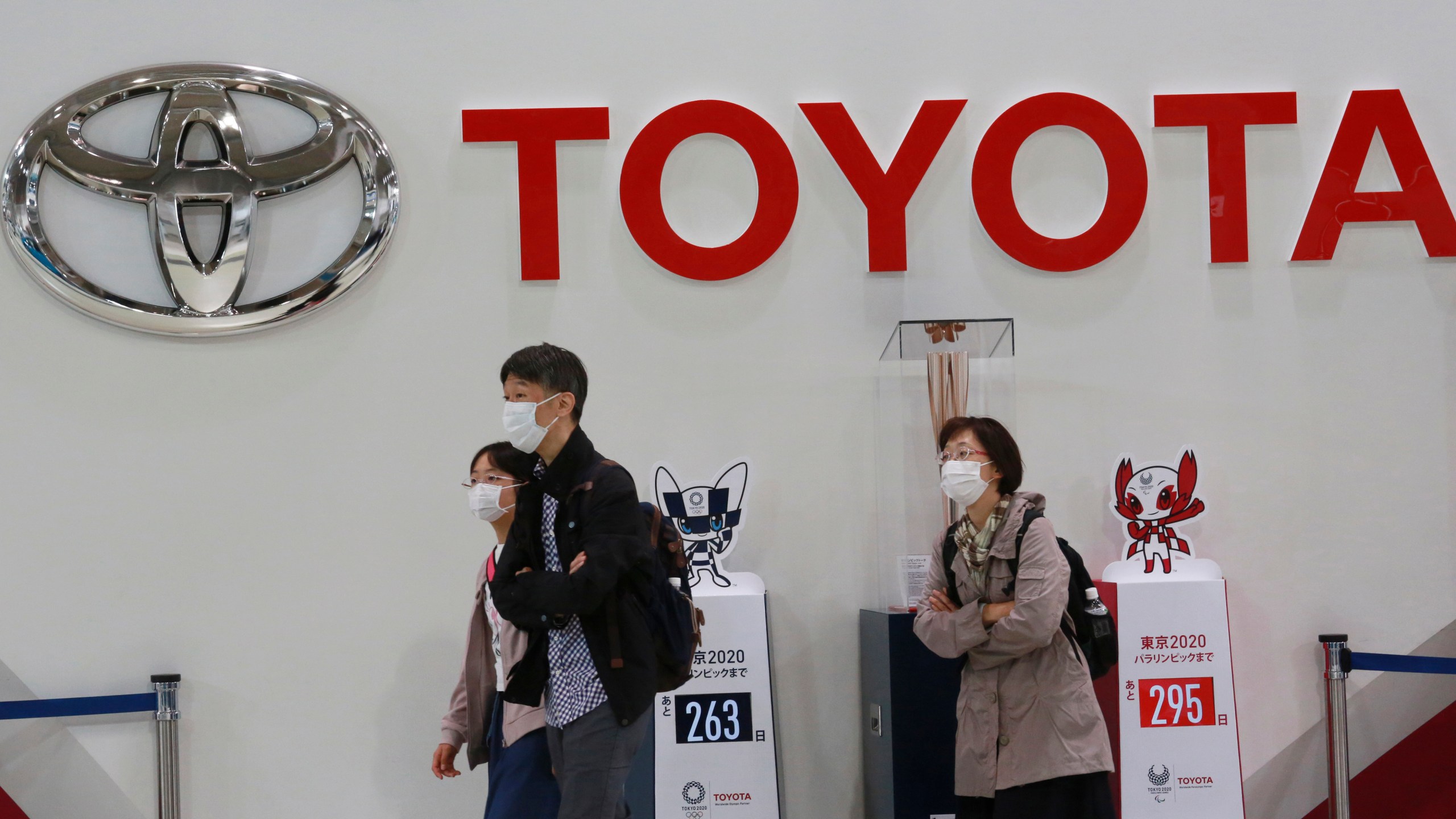 In this Nov. 2, 2020, file photo, visitors walk at a Toyota showroom in Tokyo. (AP Photo/Koji Sasahara, File)