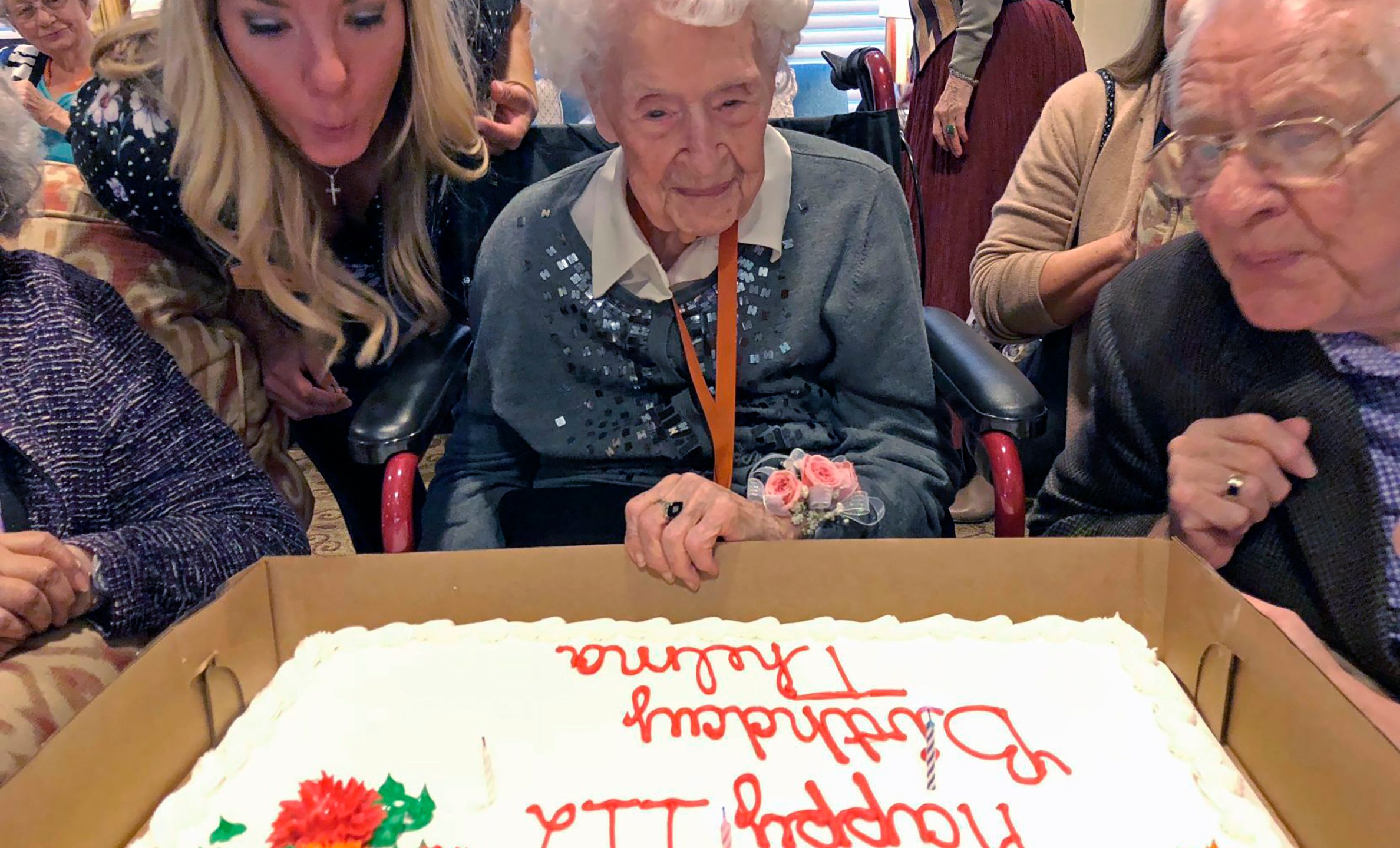 Thelma Sutcliffe is shown with a birthday cake in October 2019, in Omaha, Neb. (Mike Kelly / The World-Herald via Associated Press)