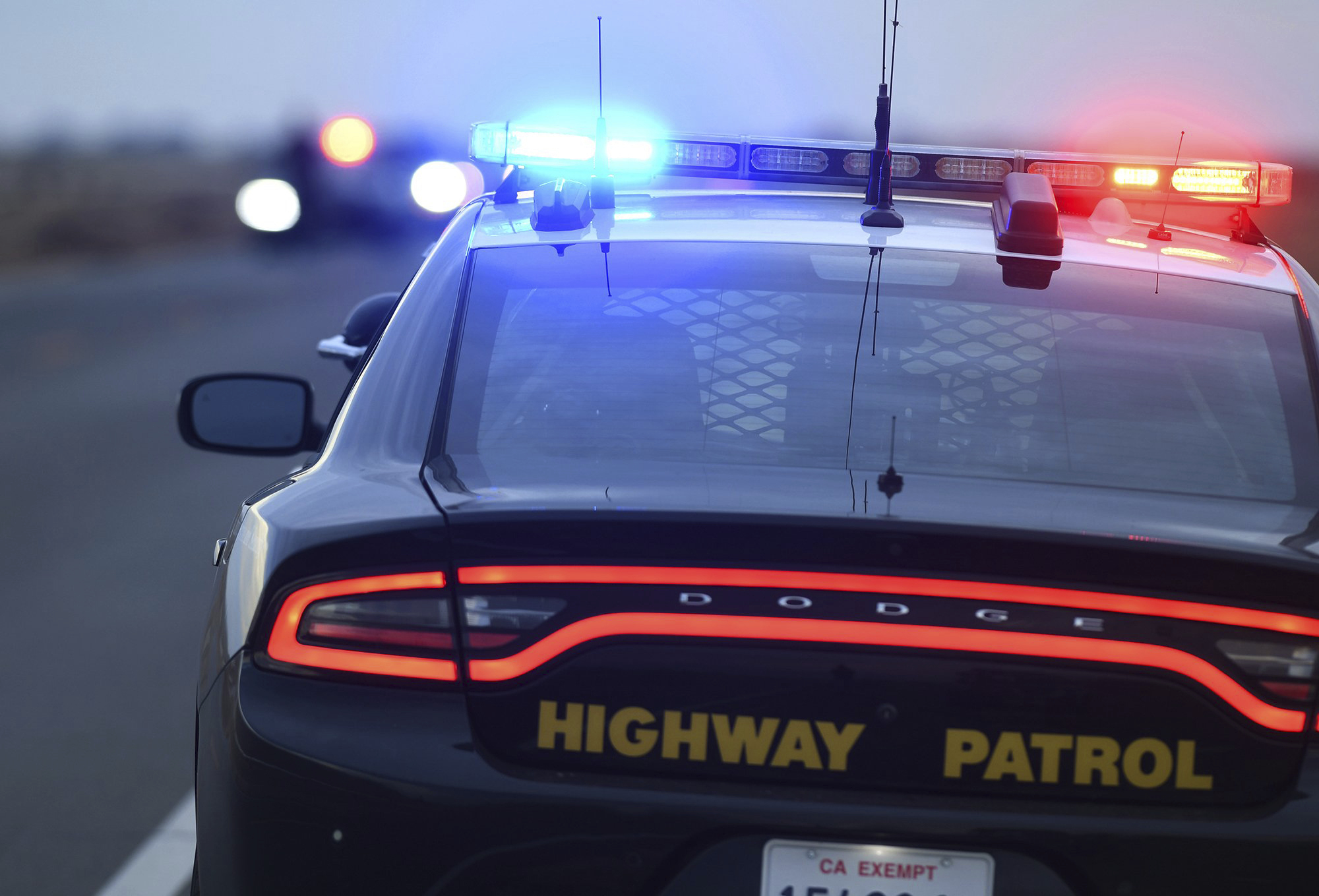 California Highway Patrol officers survey the scene a day after a fatal crash the night before on Highway 33, 13 miles south of Coalinga, Calif., Saturday, Jan. 2, 2021. (Eric Paul Zamora/The Fresno Bee via AP)