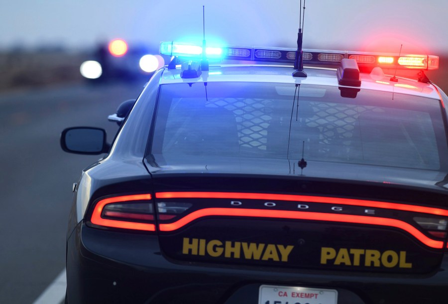 California Highway Patrol officers survey the scene a day after a fatal crash the night before on Highway 33, 13 miles south of Coalinga, Calif., Saturday, Jan. 2, 2021. (Eric Paul Zamora/The Fresno Bee via AP)