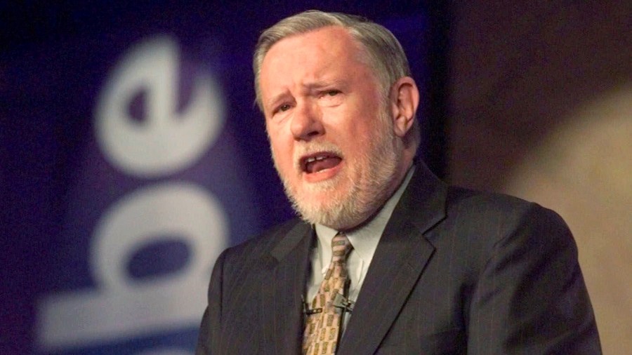 In this June 24, 1999, file photo, Dr. Charles M. Geschke, president, co-chairman and co-founder of Adobe Systems Inc., delivers his keynote address about the future of workplace information on the final day of PC Expo at New York's Jacob K. Javits Convention Center. (AP Photo/Richard Drew, File)