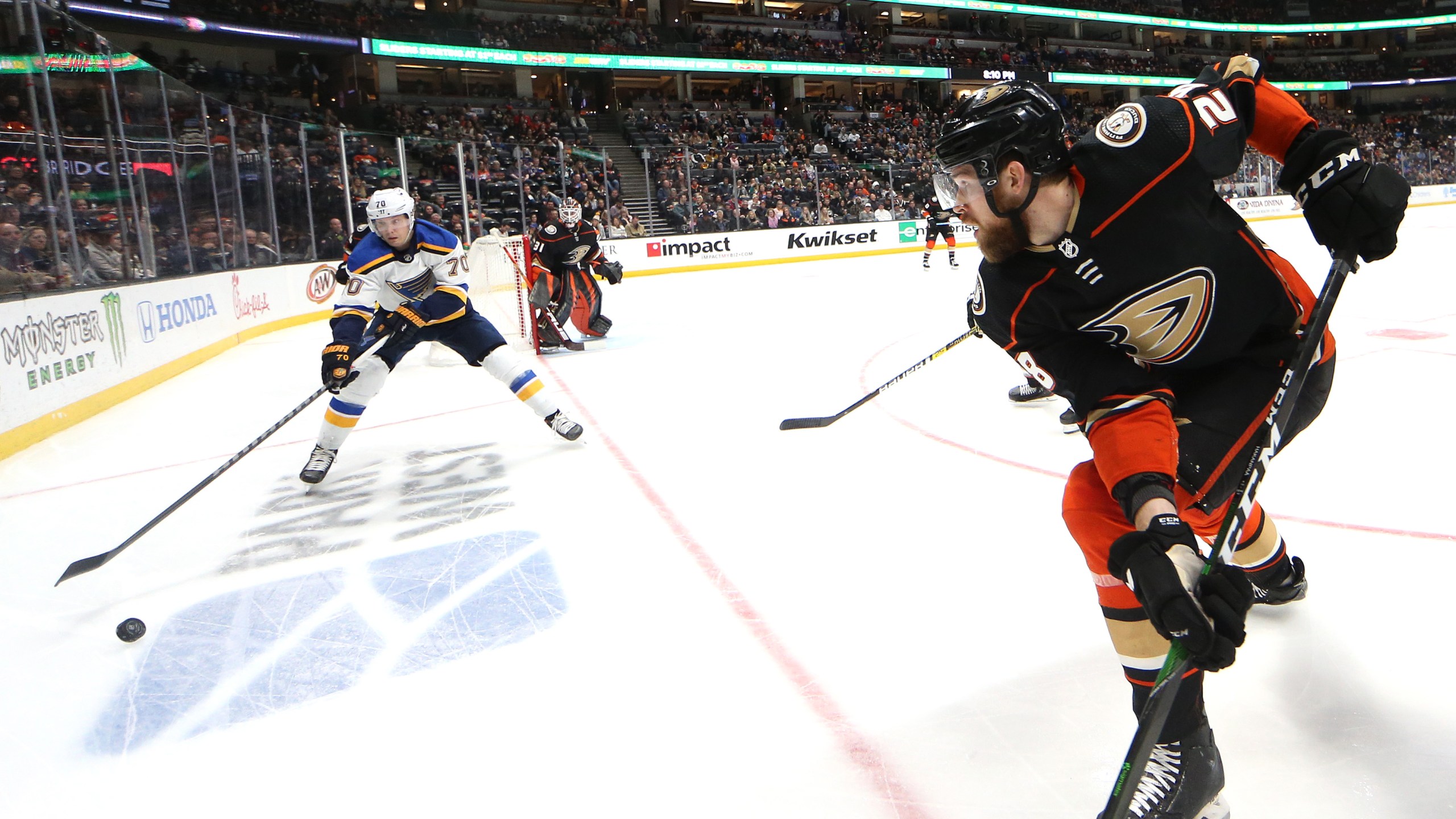 Oskar Sundqvist #70 of the St. Louis Blues controls the puck as Jani Hakanpaa #28 of the Anaheim Ducks defends during the second period of a game at Honda Center on March 11, 2020 in Anaheim. (Sean M. Haffey/Getty Images)