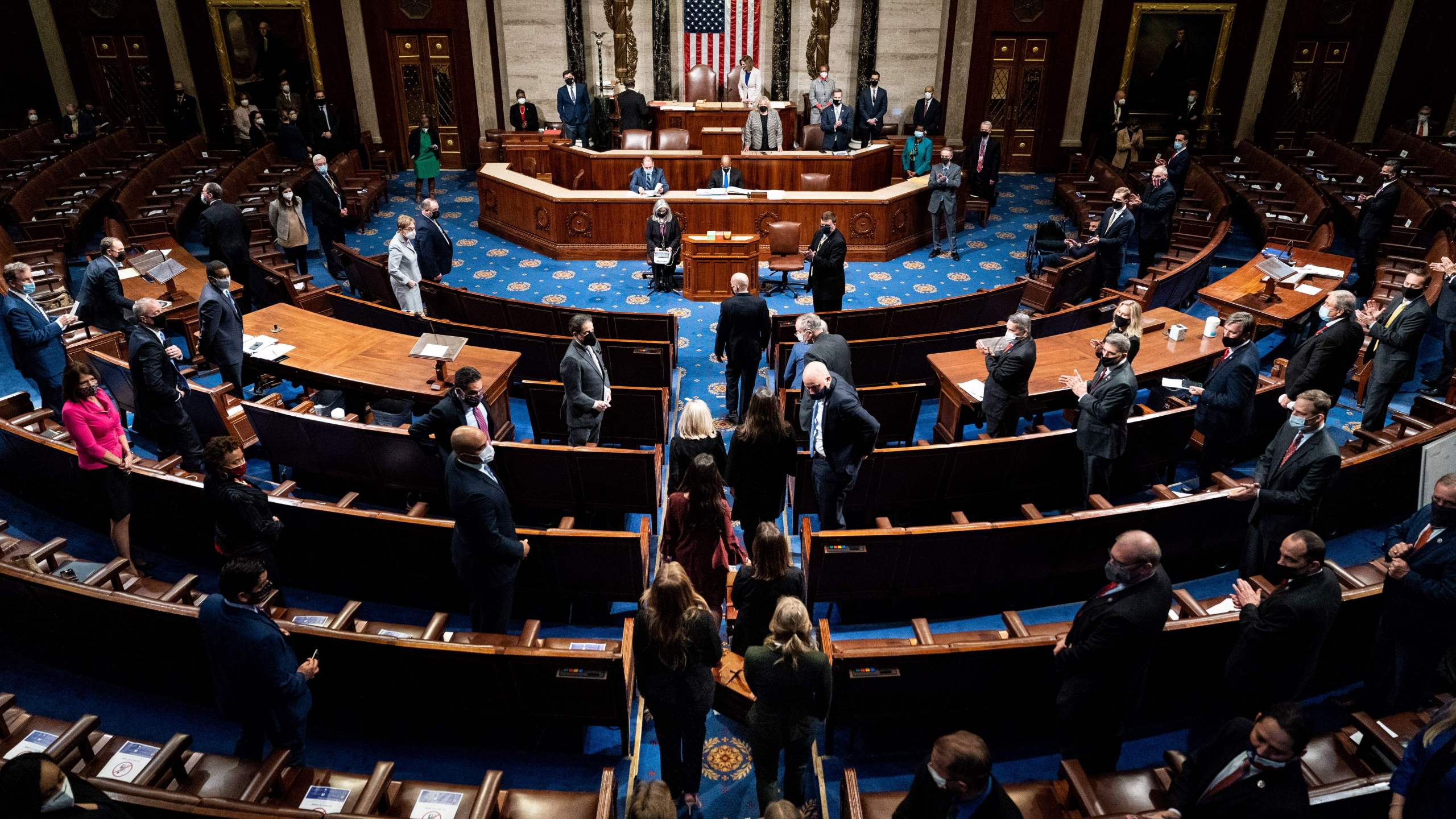 Electoral college votes are brought in before House Speaker Nancy Pelosi and Vice President Mike Pence resume presiding over a Joint session of Congress to certify the 2020 Electoral College results after supporters of President Donald Trump stormed the Capitol earlier in the day on Capitol Hill in Washington, DC on January 6, 2021. (ERIN SCHAFF/POOL/AFP via Getty Images)