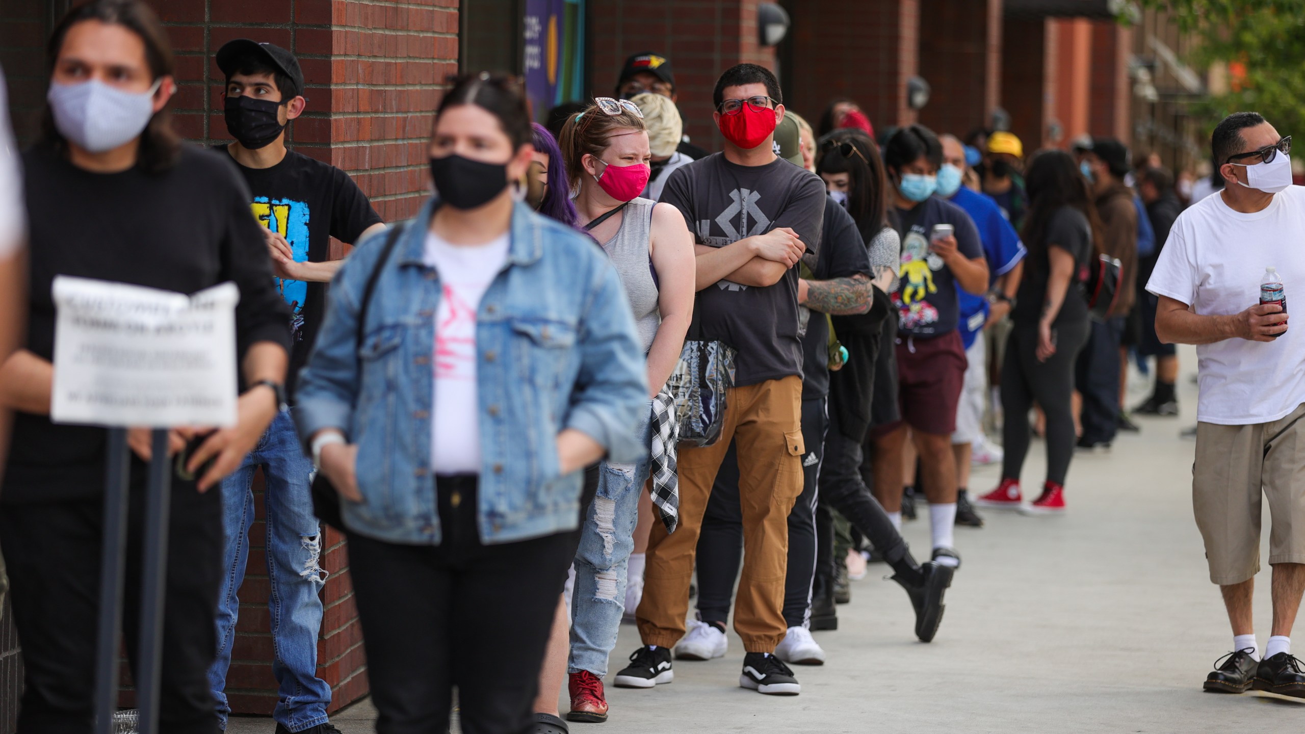 Customers wait in line on Hollywood Boulevard on April 1, 2021 in Los Angeles. (Rich Fury/Getty Images)