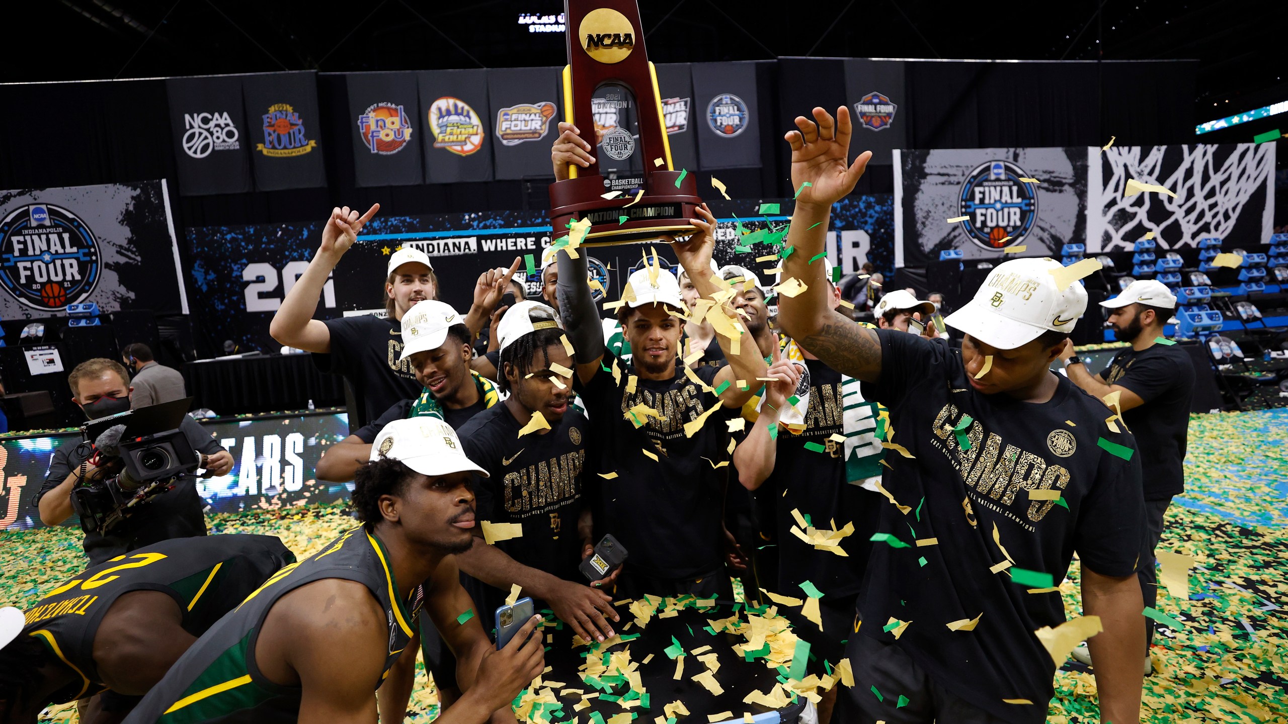 MaCio Teague #31 of the Baylor Bears holds up the trophy after defeating the Gonzaga Bulldogs 86-70 in the National Championship game of the 2021 NCAA Men's Basketball Tournament at Lucas Oil Stadium on April 5, 2021, in Indianapolis, Indiana. (Jamie Squire/Getty Images)