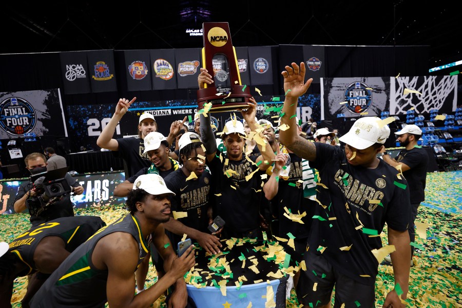 MaCio Teague #31 of the Baylor Bears holds up the trophy after defeating the Gonzaga Bulldogs 86-70 in the National Championship game of the 2021 NCAA Men's Basketball Tournament at Lucas Oil Stadium on April 5, 2021, in Indianapolis, Indiana. (Jamie Squire/Getty Images)