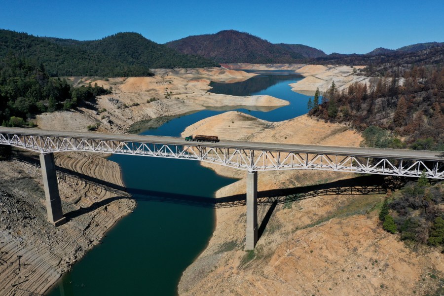 In an aerial view, a truck drives on the Enterprise Bridge over a section of Lake Oroville on April 27, 2021 in Oroville. (Justin Sullivan/Getty Images)