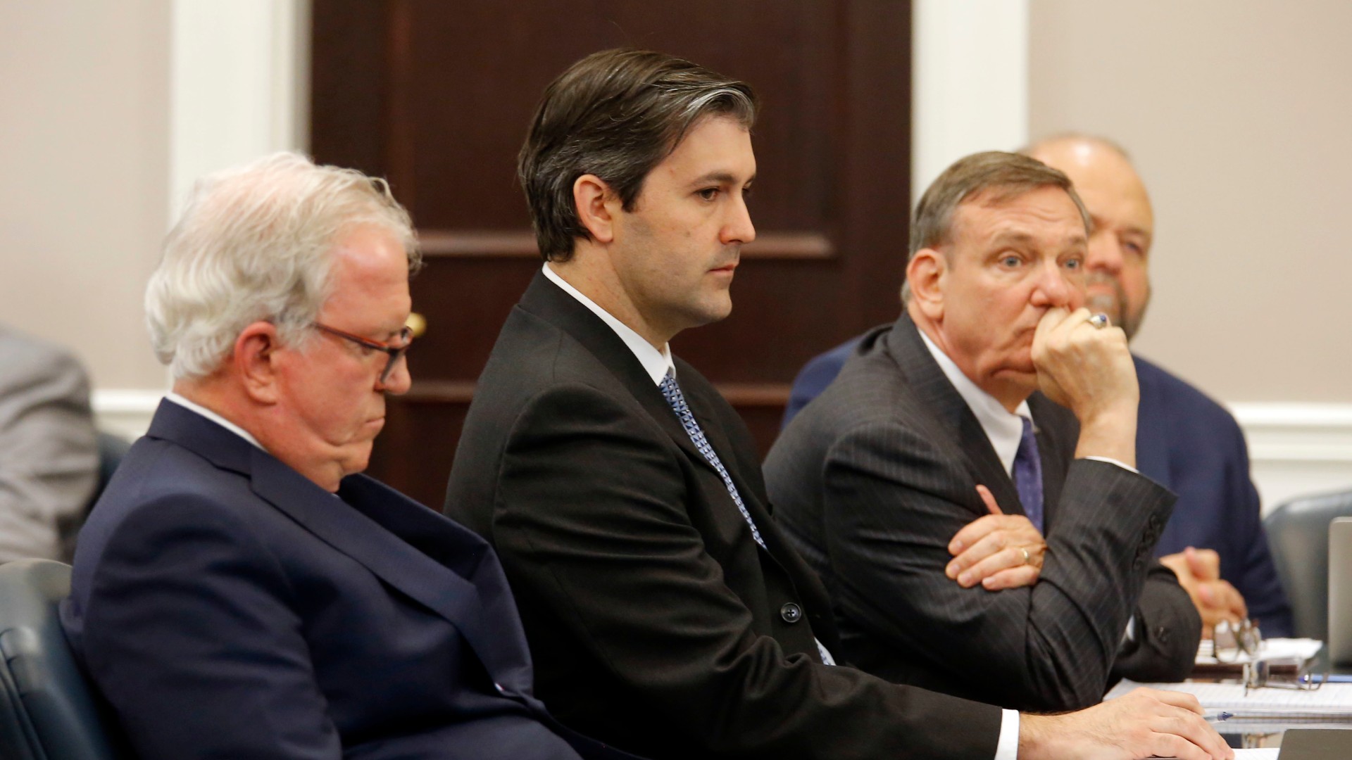 In this Dec. 5, 2016 file photo, defense attorneys Andy Savage, left, Don McCune, and Miller Shealy, right, sit around former North Charleston police officer Michael Slager at theCharleston County court in Charleston, S.C. (Grace Beahm/Post and Courier via AP, Pool)