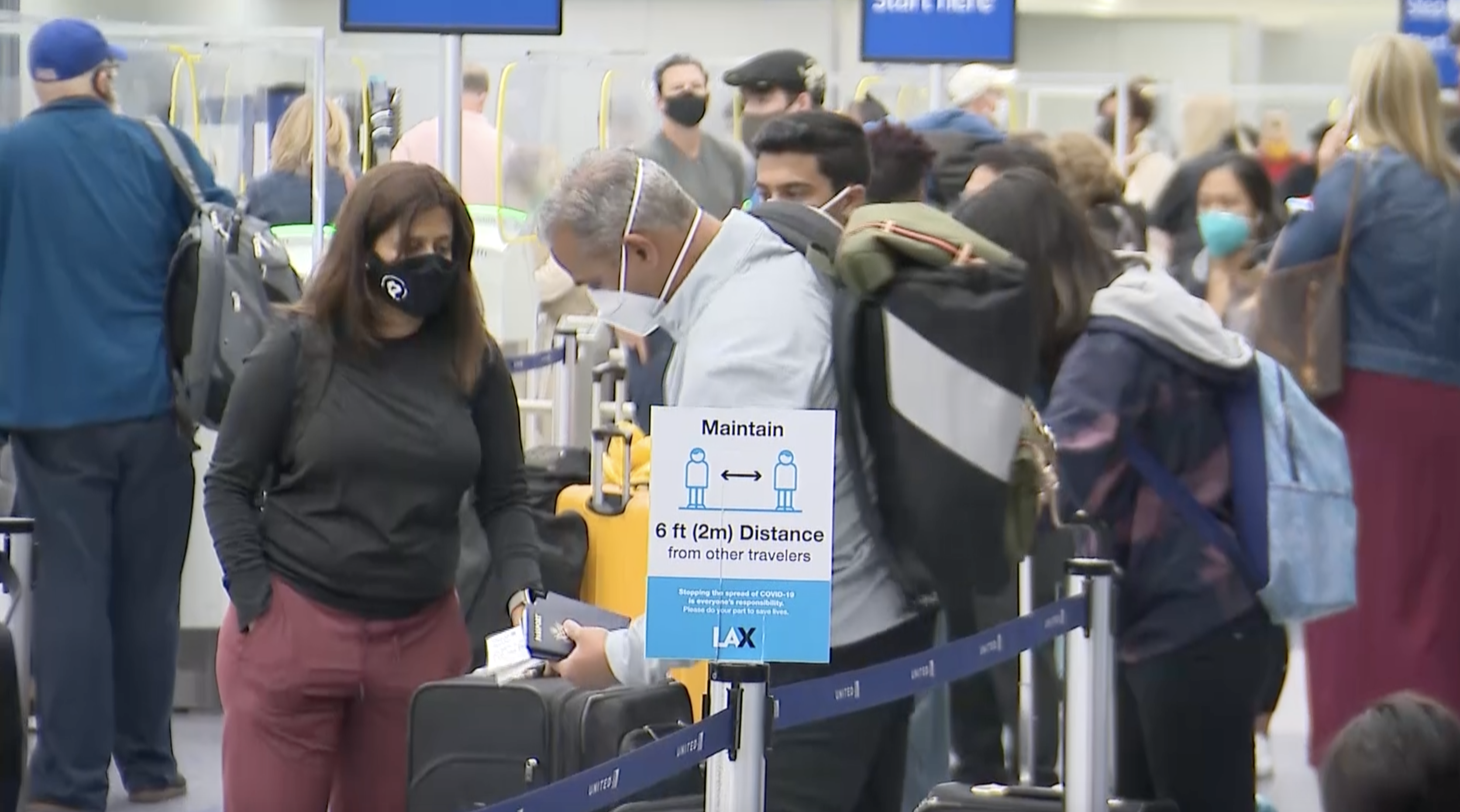 Travelers crowd LAX in April 2021. (KTLA)