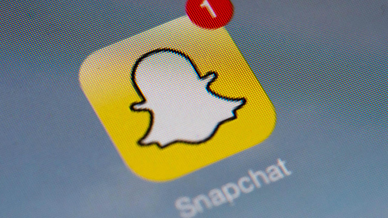 The logo of mobile app "Snapchat" is displayed on a tablet on January 2, 2014 in Paris. (LIONEL BONAVENTURE/AFP via Getty Images)