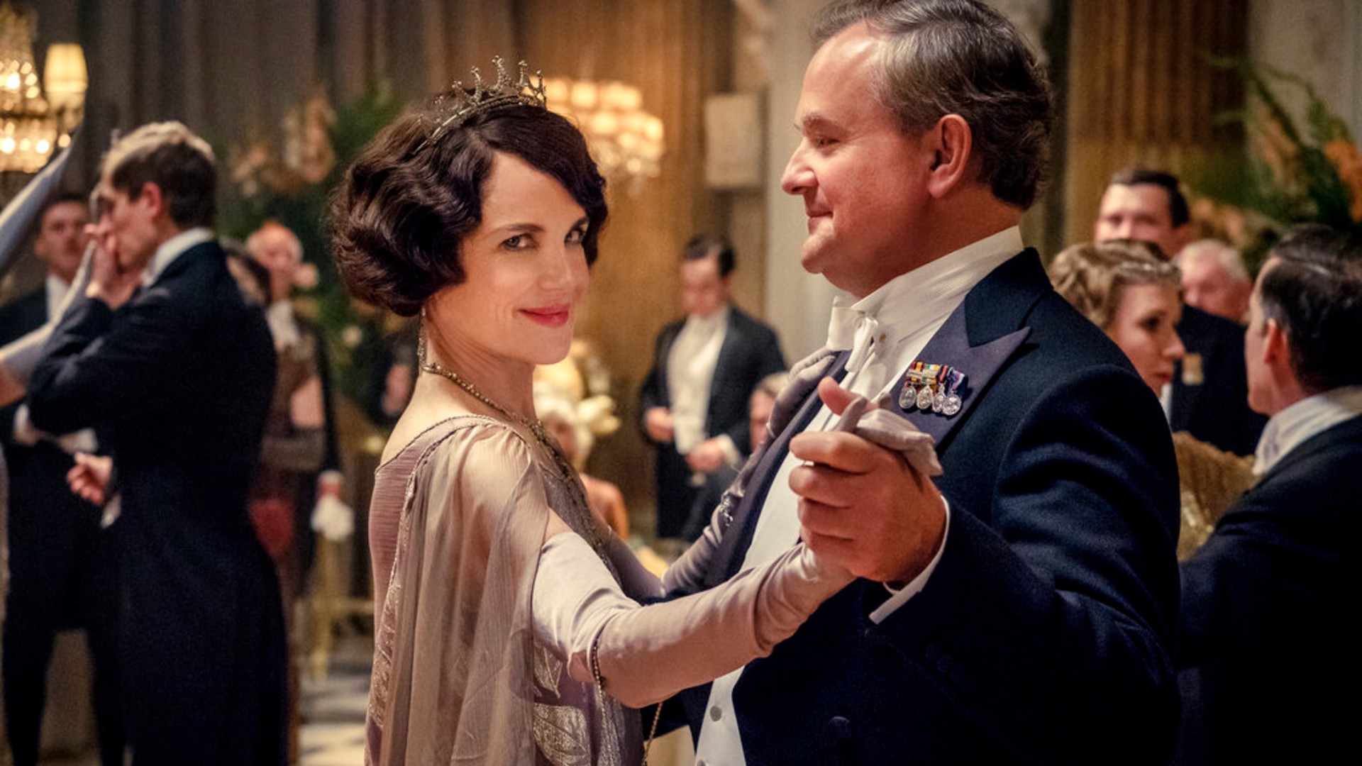 This image released by Focus Features shows Elizabeth McGovern, left, as Lady Grantham and Hugh Bonneville, as Lord Grantham, in "Downton Abbey". (Jaap Buitendijk/Focus Features via AP)