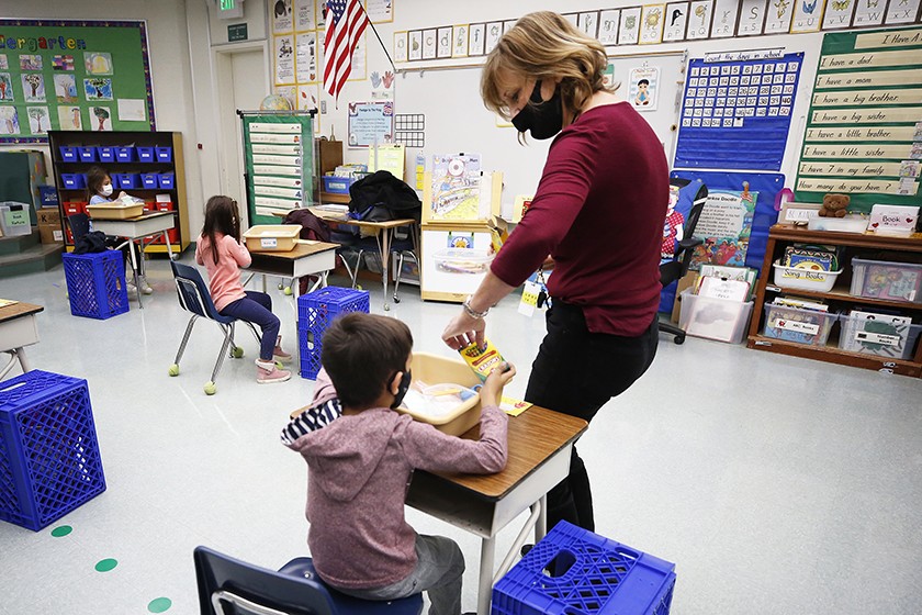 A kindergarten teacher collects crayons from students at Lupine Hill Elementary School in Calabasas last November. A steep drop this year in California K-12 school enrollment stems in part from 61,000 missing kindergarteners.(Al Seib / Los Angeles Times)