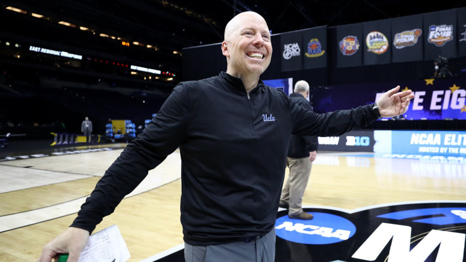 Head coach Mick Cronin of the UCLA Bruins celebrates defeating the Michigan Wolverines 51-49 in the Elite Eight round game of the 2021 NCAA Men's Basketball Tournament at Lucas Oil Stadium on March 30, 2021 in Indianapolis, Indiana. (Jamie Squire/Getty Images)