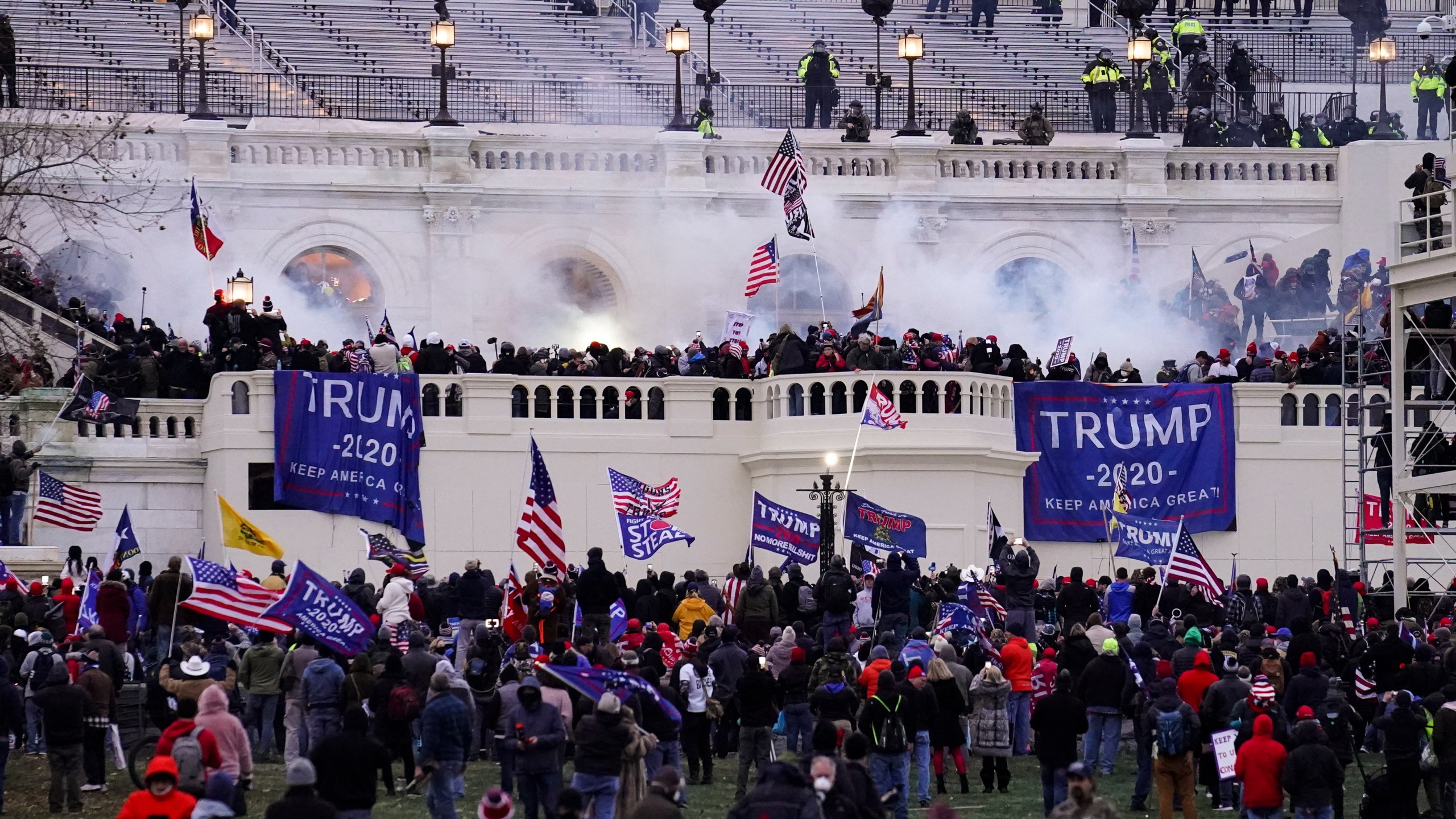 In this Jan. 6. 2021, file photo, people storm the Capitol in Washington. (AP Photo/John Minchillo)