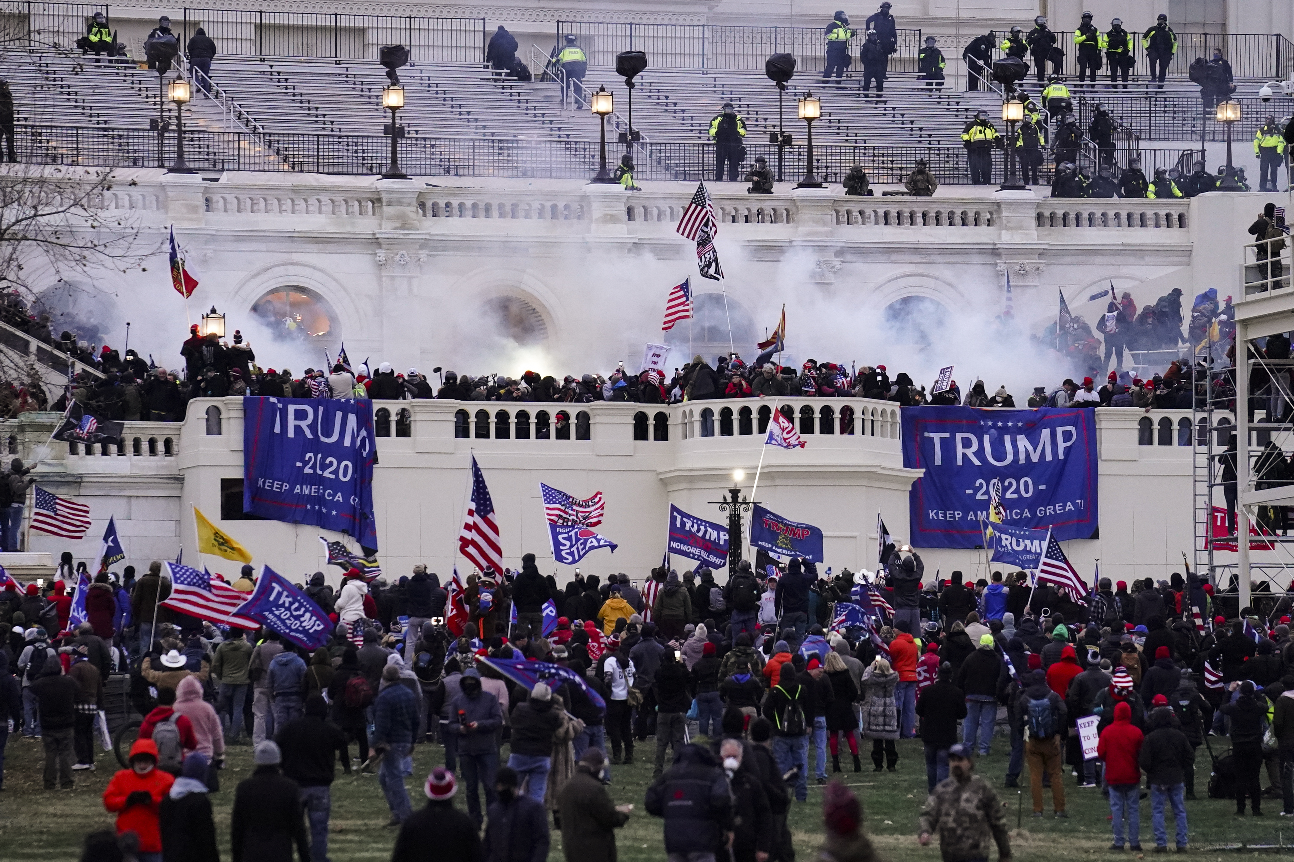 In this Jan. 6. 2021, file photo, people storm the Capitol in Washington. (AP Photo/John Minchillo)