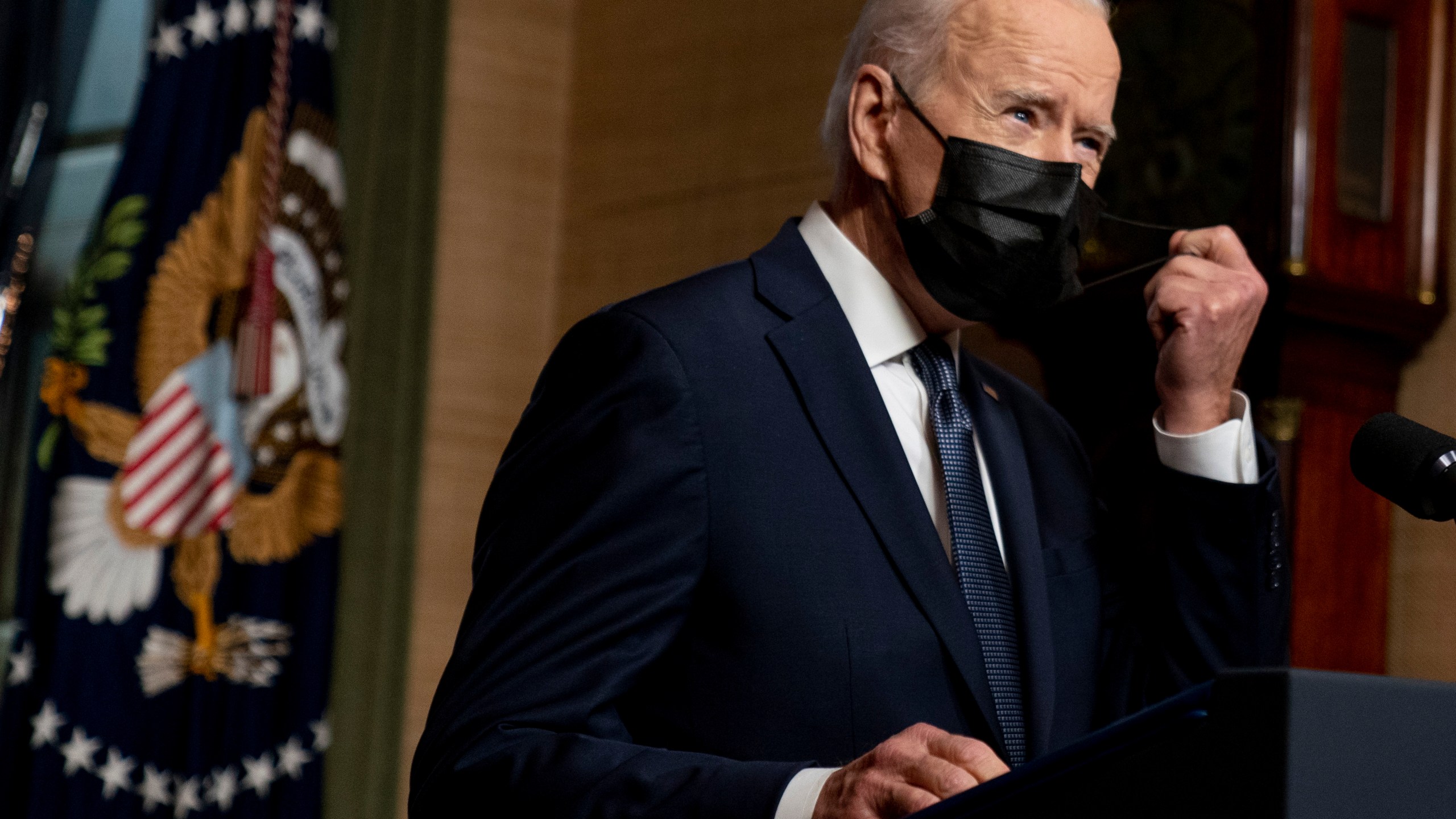 In this Wednesday, April 14, 2021, file photo, President Joe Biden removes his mask to speak at a news conference at the White House, in Washington. Ten liberal senators are urging Biden to back India and South Africa’s appeal to the World Trade Organization to temporarily relax intellectual property rules so coronavirus vaccines can be manufactured by nations that are struggling to inoculate their population. (AP Photo/Andrew Harnik, Pool, File)