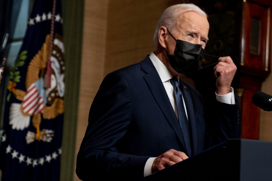 In this Wednesday, April 14, 2021, file photo, President Joe Biden removes his mask to speak at a news conference at the White House, in Washington. Ten liberal senators are urging Biden to back India and South Africa’s appeal to the World Trade Organization to temporarily relax intellectual property rules so coronavirus vaccines can be manufactured by nations that are struggling to inoculate their population. (AP Photo/Andrew Harnik, Pool, File)