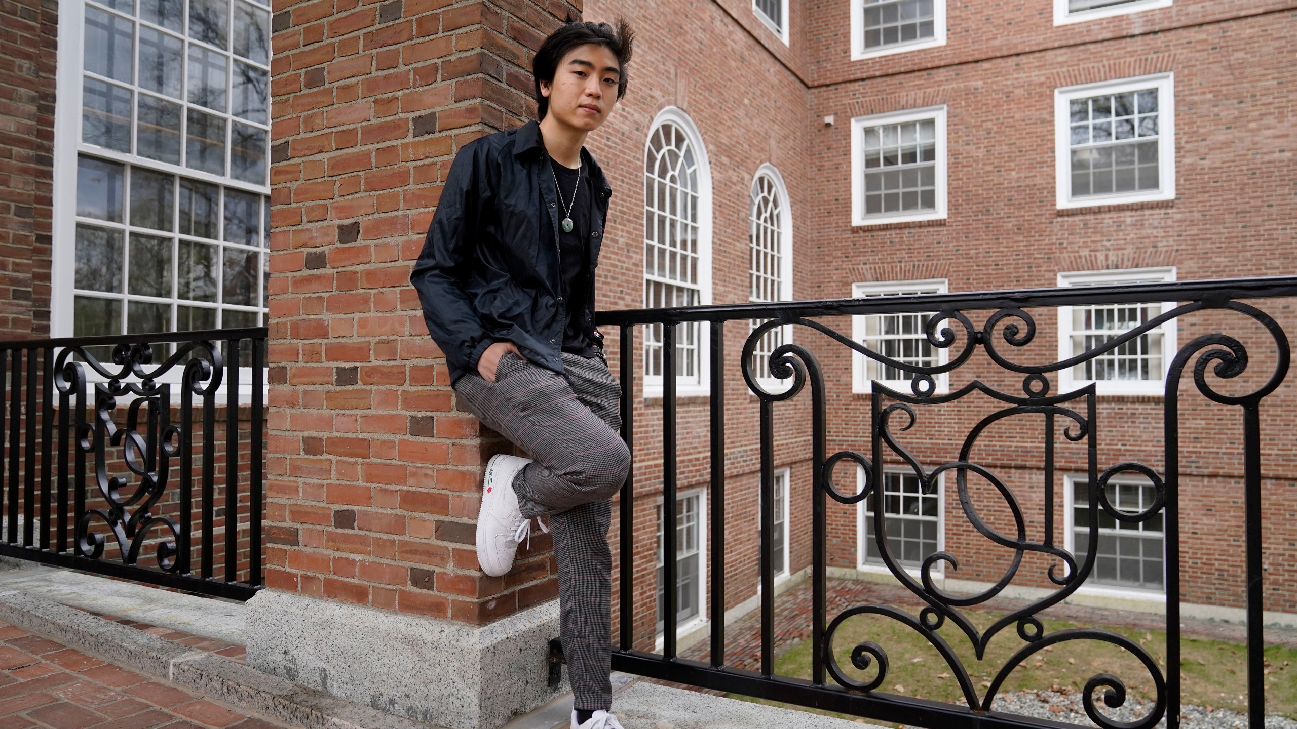 Nicholas Sugiarto, of San Diego, Calif., a student at Dartmouth College, stands for a photograph on the school's campus, Tuesday, April 20, 2021, in Hanover, N.H. A wave of anti-Asian attacks that started more than a year ago with the pandemic, along with the March 2021 shootings in Atlanta that left six Asian women dead, have provoked national conversations about the visibility of Asian Americans. (AP Photo/Steven Senne)