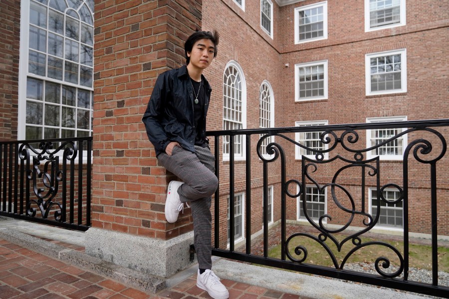 Nicholas Sugiarto, of San Diego, Calif., a student at Dartmouth College, stands for a photograph on the school's campus, Tuesday, April 20, 2021, in Hanover, N.H. A wave of anti-Asian attacks that started more than a year ago with the pandemic, along with the March 2021 shootings in Atlanta that left six Asian women dead, have provoked national conversations about the visibility of Asian Americans. (AP Photo/Steven Senne)