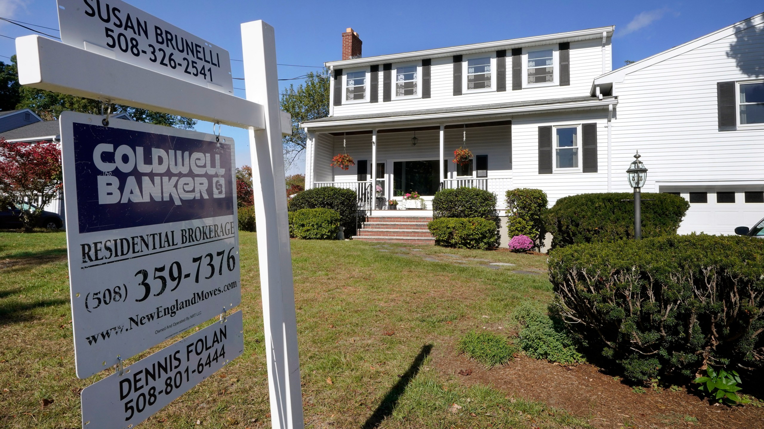 In this Oct. 6, 2020 file photo, a real estate brokerage sign stands in front of a house in Norwood, Mass. (AP Photo/Steven Senne)