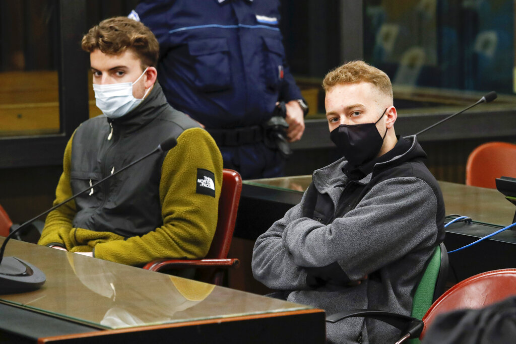 In this April 29, 2021 file photo, Gabriel Natale-Hjorth, left, and his co-defendant Finnegan Lee Elder, both from the United States, wear face masks to curb the spread of COVID-19 as they sit during a break of a hearing of their trial in Rome. (Remo Casilli/Pool Photo via AP)