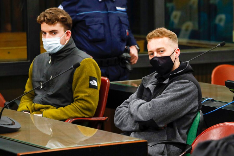 In this April 29, 2021 file photo, Gabriel Natale-Hjorth, left, and his co-defendant Finnegan Lee Elder, both from the United States, wear face masks to curb the spread of COVID-19 as they sit during a break of a hearing of their trial in Rome. (Remo Casilli/Pool Photo via AP)