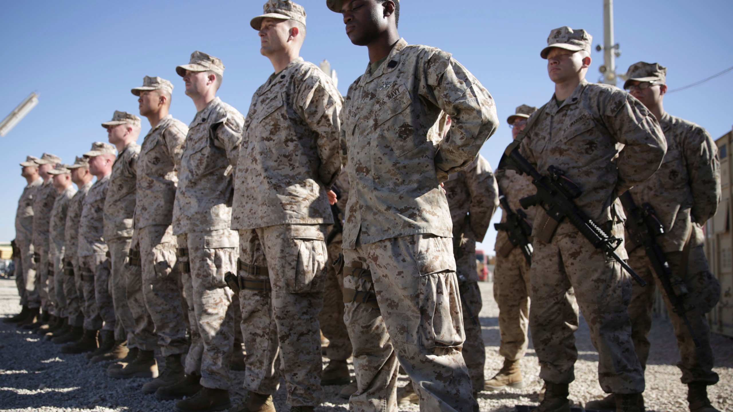 In this Jan. 15, 2018, file photo, U.S. Marines watch during the change of command ceremony at Task Force Southwest military field in Shorab military camp of Helmand province, Afghanistan.(AP Photo/Massoud Hossaini, File)