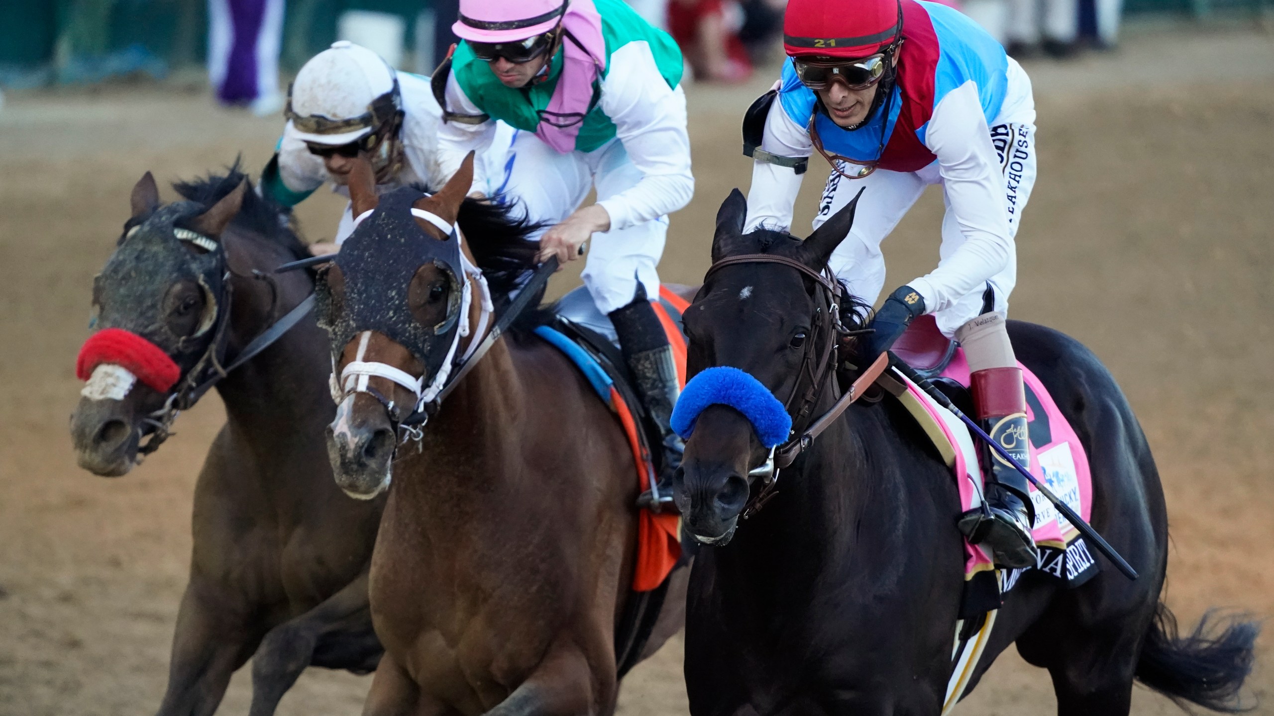 John Velazquez riding Medina Spirit leads Florent Geroux on Mandaloun and Flavien Prat riding Hot Rod Charlie to win the 147th running of the Kentucky Derby at Churchill Downs, Saturday, May 1, 2021, in Louisville, Ky. (AP Photo/Jeff Roberson)