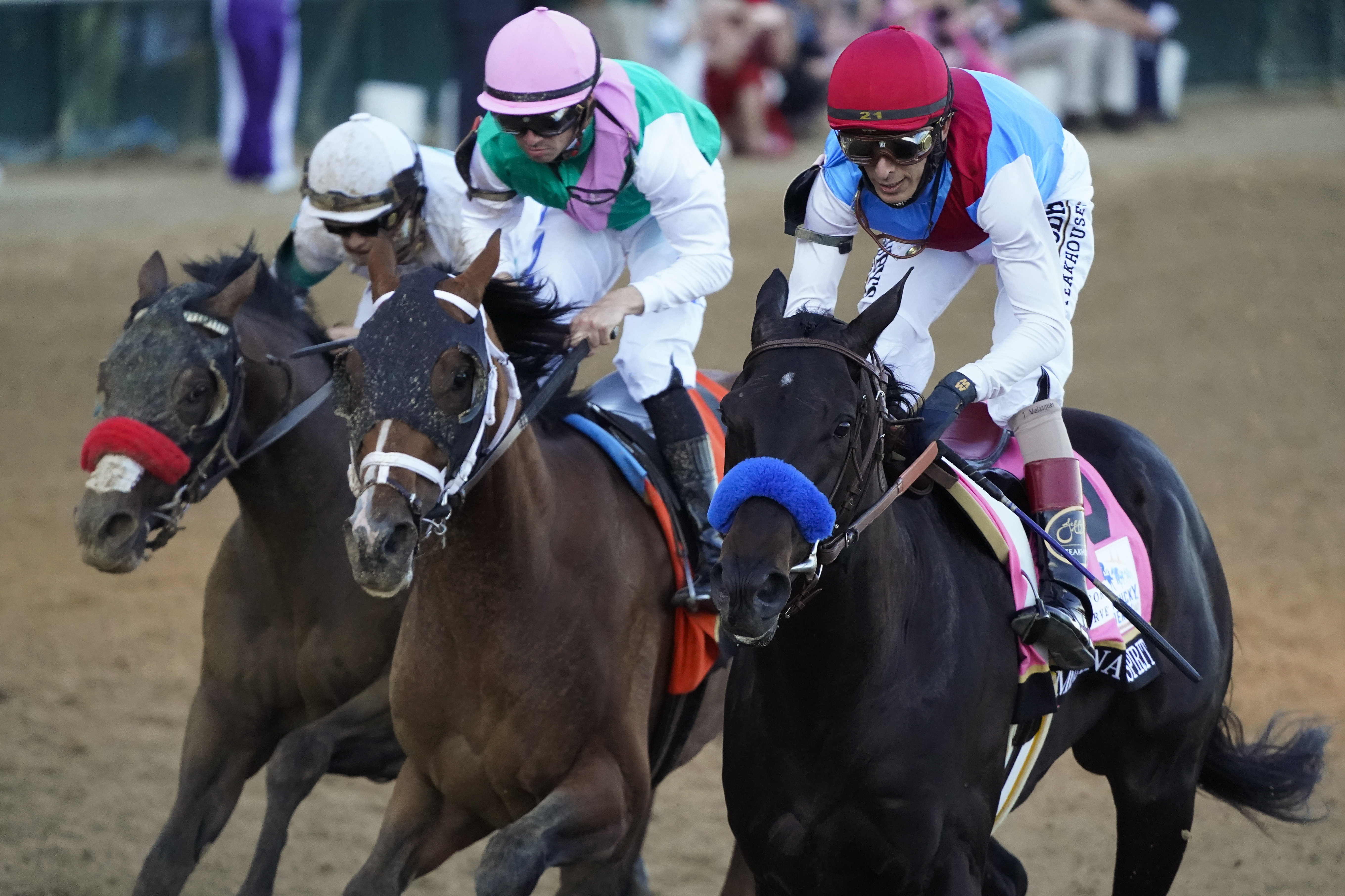 John Velazquez riding Medina Spirit leads Florent Geroux on Mandaloun and Flavien Prat riding Hot Rod Charlie to win the 147th running of the Kentucky Derby at Churchill Downs, Saturday, May 1, 2021, in Louisville, Ky. (AP Photo/Jeff Roberson)