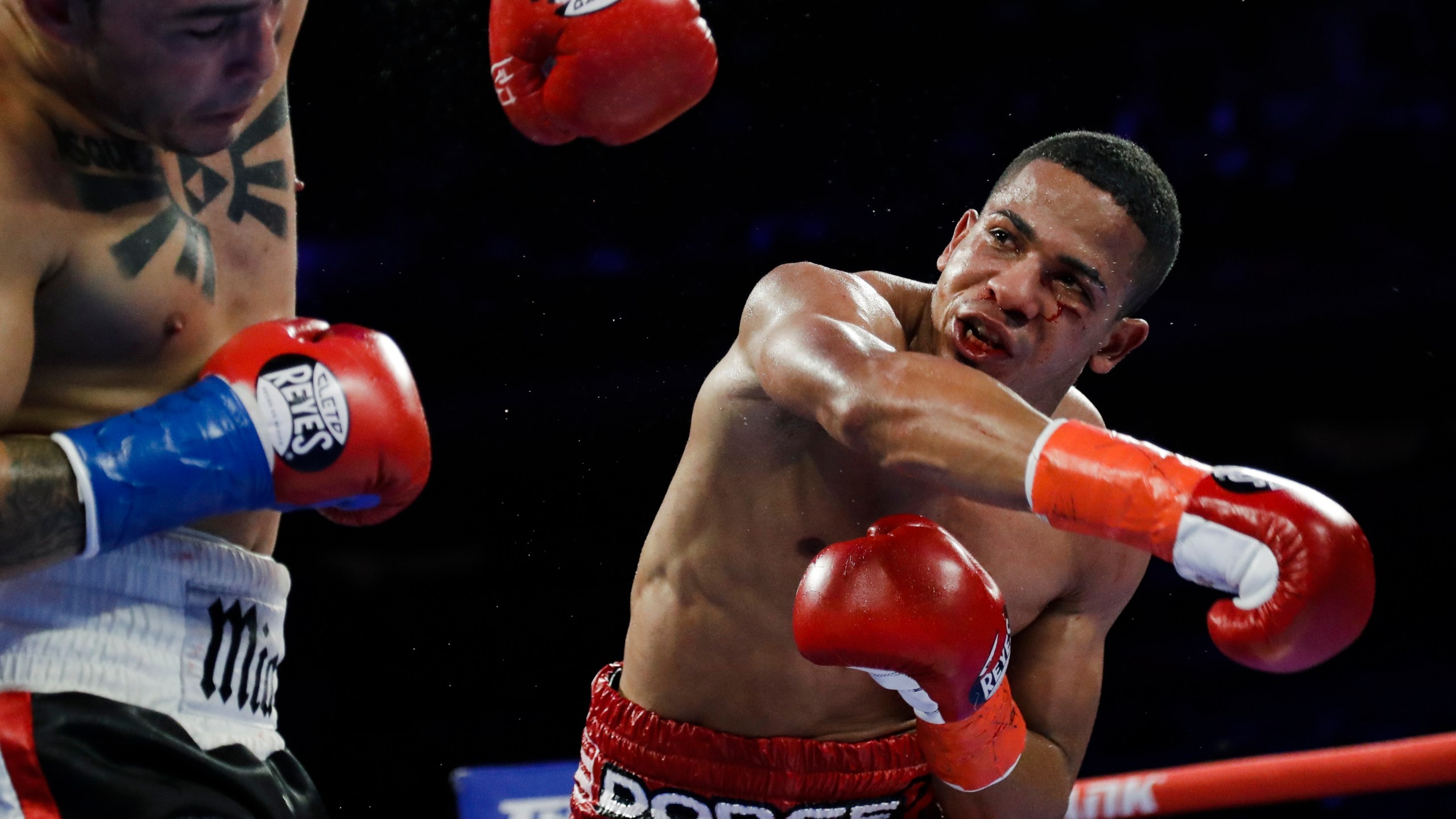 In this April 20, 2019 file photo, Puerto Rico's Felix Verdejo, right, punches Costa Rica's Bryan Vazquez during the fifth round of a lightweight boxing match in New York. Verdejo has turned himself in to federal agents on Saturday, May 1, 2021, just hours after authorities identified the body of his 27-year-old lover Keishla Rodríguez in a lagoon in the U.S. territory, a couple of days after she was reported missing. (AP Photo/Frank Franklin II, File)