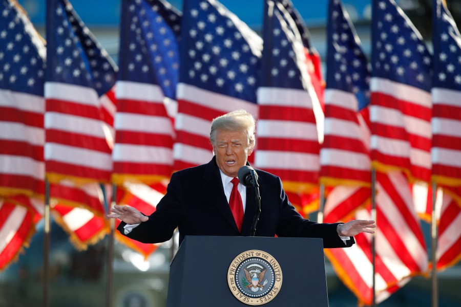 President Donald Trump speaks to crowd before boarding Air Force One at Andrews Air Force Base, Md., in this Wednesday, Jan. 20, 2021, file photo. (AP Photo/Luis M. Alvarez, File)