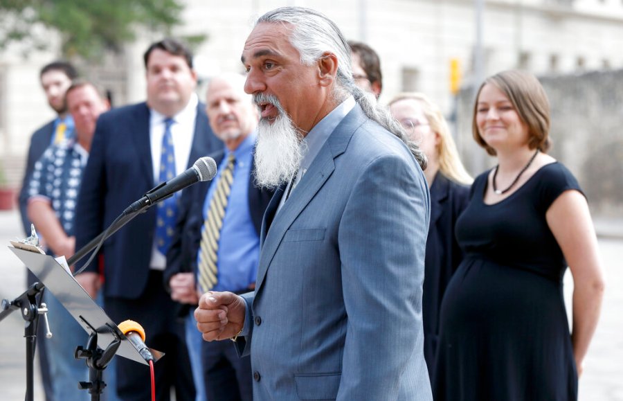 In this May 1, 2014 file photo, Libertarian party candidate for Texas attorney general Jamie Balagia speaks in front of the Alamo in San Antonio, Texas, about his election platform. (William Luther/The San Antonio Express-News via AP)