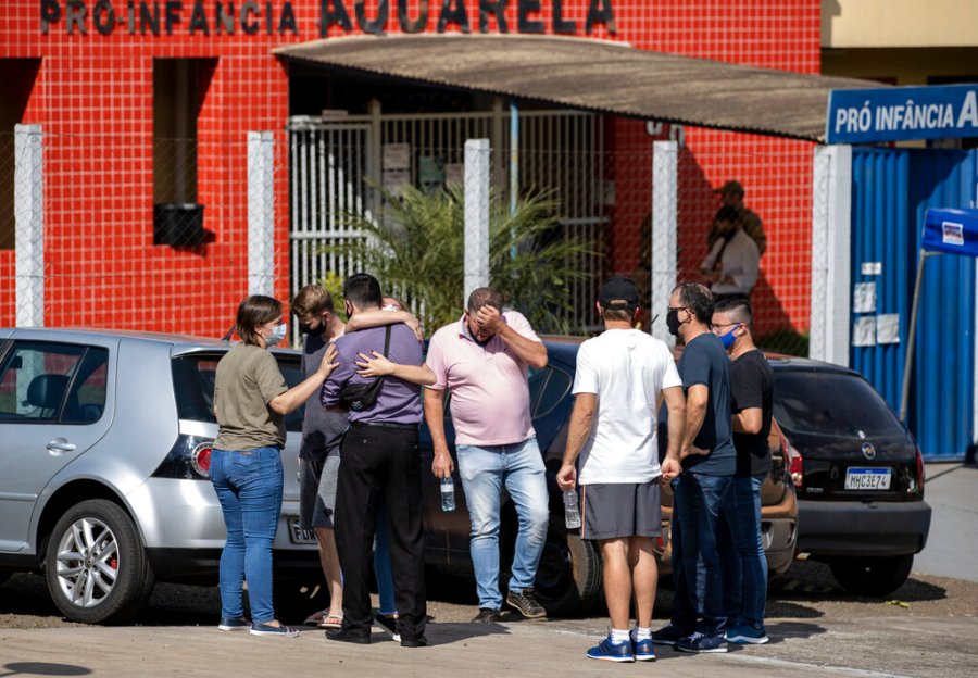 Relatives gather outside the Aquarela preschool in Saudades, in the southern state of Santa Catarina, Brazil, Tuesday, May 4, 2021. (AP Photo/Liamara Polli)