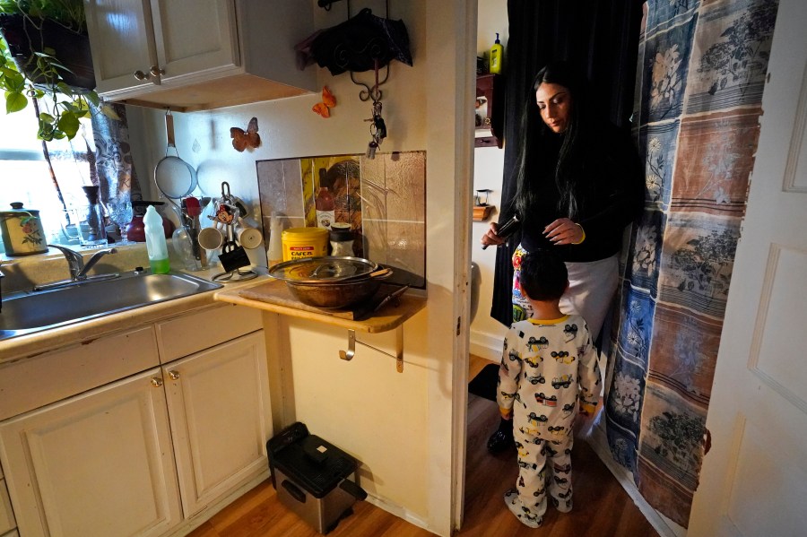 In this March 10, 2021, file photo, Isabel Miranda brushes the hair of her 4-year-old son, Julian, in their rental apartment in Haverhill, Mass. A federal judge has ruled, Wednesday, May 5, 2021, that the Centers for Disease Control exceeded its authority when it imposed a federal eviction moratorium to provide protection for renters out of concern that having families lose their homes and move into shelters or share crowded conditions with relatives or friends during the pandemic would further spread the highly contagious virus. Miranda and her family would no longer have this eviction protection if this ruling stands. (AP Photo/Elise Amendola, File)