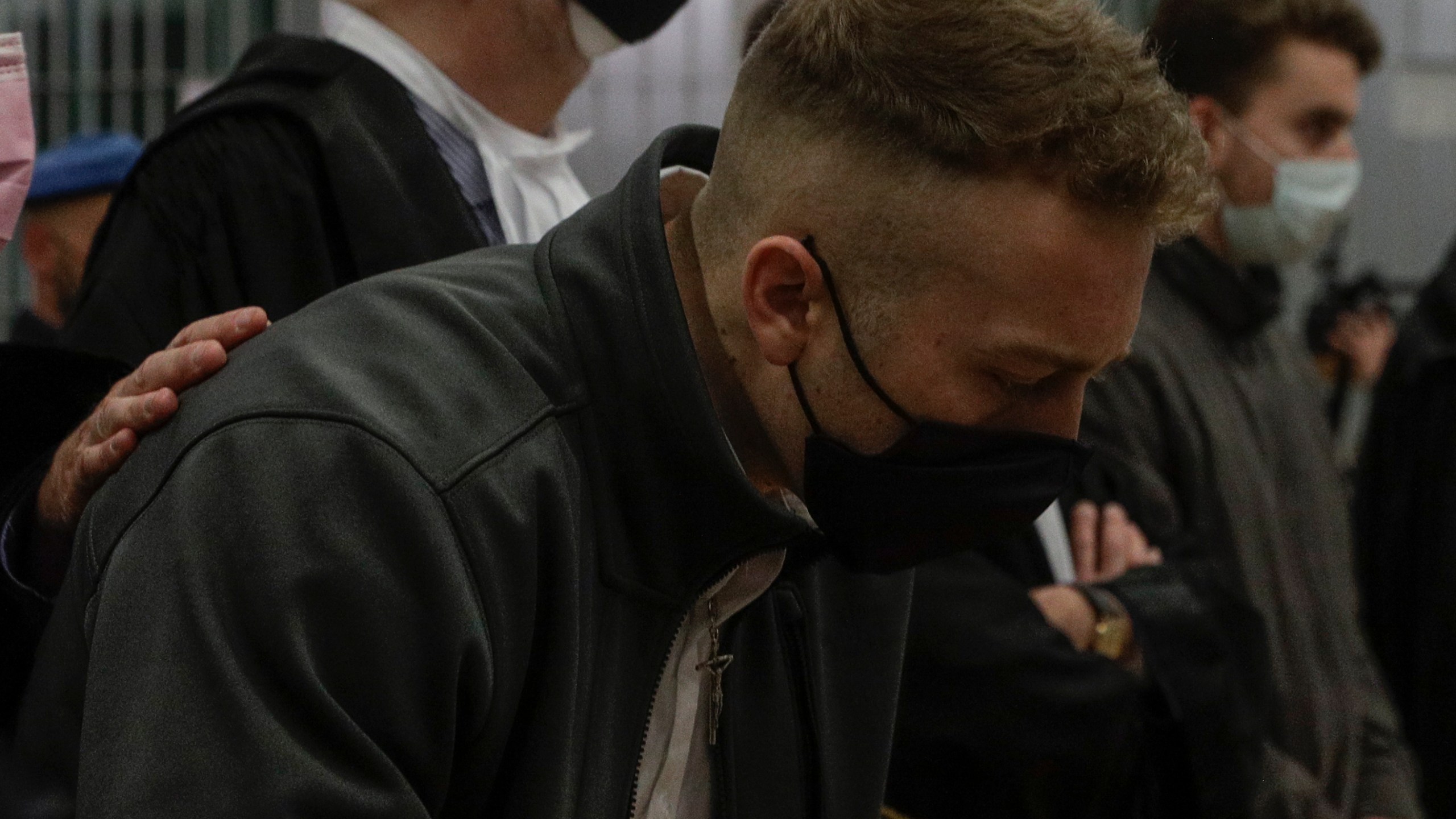 Finnegan Lee Elder and his co-defendant Gabriel Natale-Hjorth, right, listen as the verdict is read, in the trial for the slaying of an Italian plainclothes police officer on a street near the hotel where they were staying while on vacation in Rome in summer 2019, in Rome, Wednesday, May 5, 2021. A jury in Rome on Wednesday convicted two American friends in the 2019 slaying of a police officer in a drug sting gone awry, sentencing them to life in prison. The jury deliberated more than 12 hours before delivering the verdicts against Finnegan Lee Elder, 21, and Gabriel Natale Hjorth, 20, handing them Italy's stiffest sentence. (AP Photo/Gregorio Borgia)