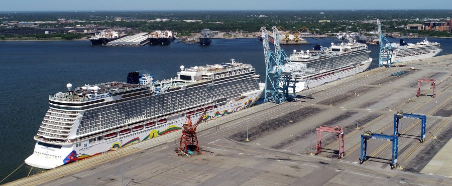 In this May 4, 2020 file photo, Norwegian cruise ships are docked at Portsmouth Marine Terminal in Portsmouth, Va. Norwegian Cruise Lines is threatening to skip Florida ports because of the governor's order banning businesses from requiring that customers be vaccinated against COVID-19. The company says Gov. Ron DeSantis' order conflicts with guidelines from federal health authorities that would let cruise ships sail in U.S. waters if passengers and crew members are vaccinated. (Stephen M. Katz/The Virginian-Pilot via AP, File)