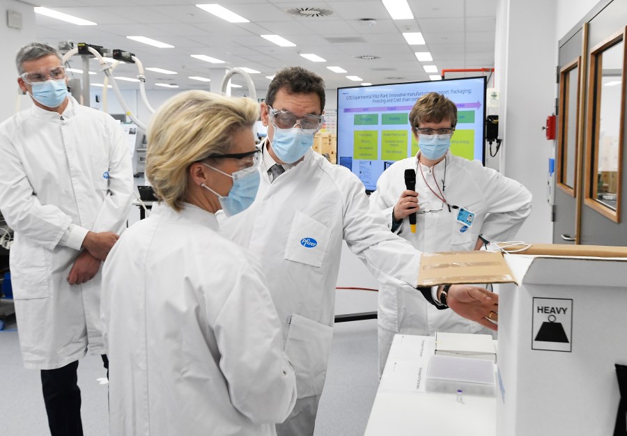 In this Friday, April 23, 2021 file photo, European Commission President Ursula von der Leyen, second left, speaks with Pfizer CEO Albert Bourla, center right, during an official visit to the Pfizer pharmaceutical company in Puurs, Belgium. (John Thys/Pool via AP, File)