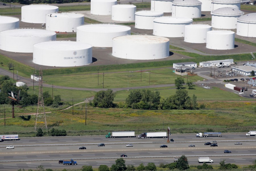 In this Sept. 8, 2008 file photo traffic on I-95 passes oil storage tanks owned by the Colonial Pipeline Company in Linden, N.J. (AP Photo/Mark Lennihan, File)