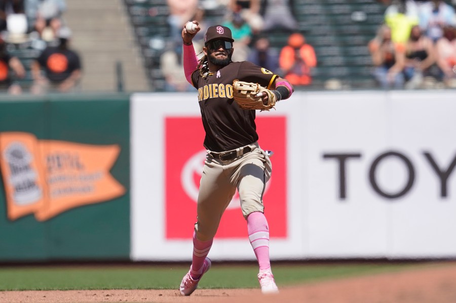 San Diego Padres shortstop Fernando Tatis Jr. throws out San Francisco Giants' Austin Slater at first base during the fifth inning of a baseball game in San Francisco on May 9, 2021. (Jeff Chiu / Associated Press)