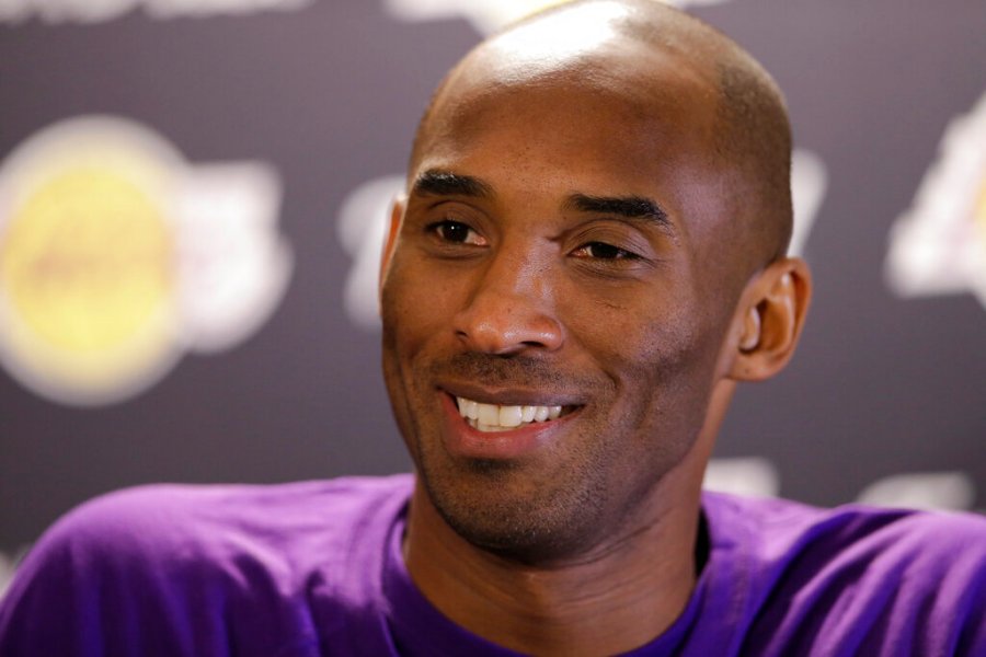 Los Angeles Lakers' Kobe Bryant speaks with members of the media ahead of a basketball game against the Philadelphia 76ers in Philadelphia, in this Tuesday, Dec. 1, 2015, file photo. (AP Photo/Matt Rourke, File)